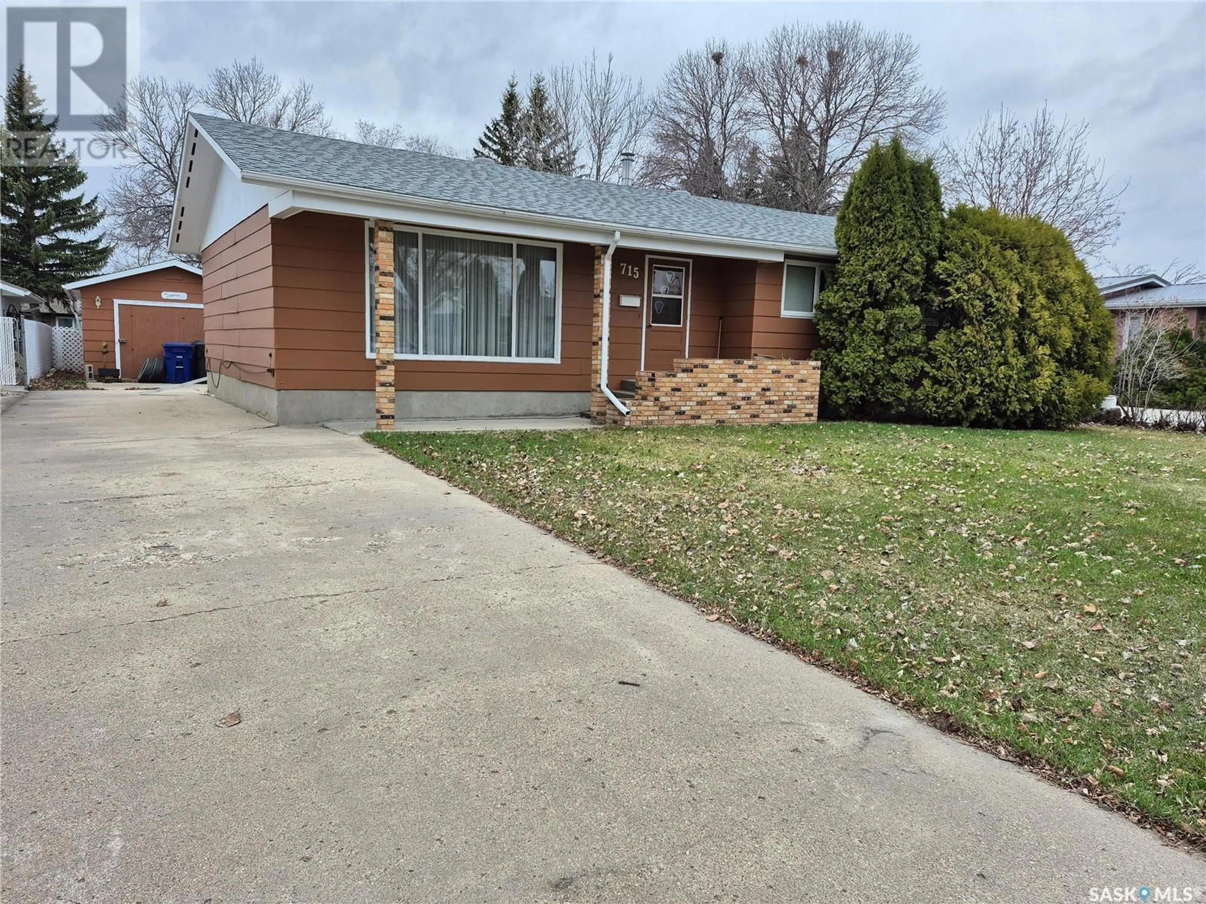 Home with brick exterior material, street for 715 BRIMACOMBE DRIVE, Weyburn Saskatchewan S4H2P7