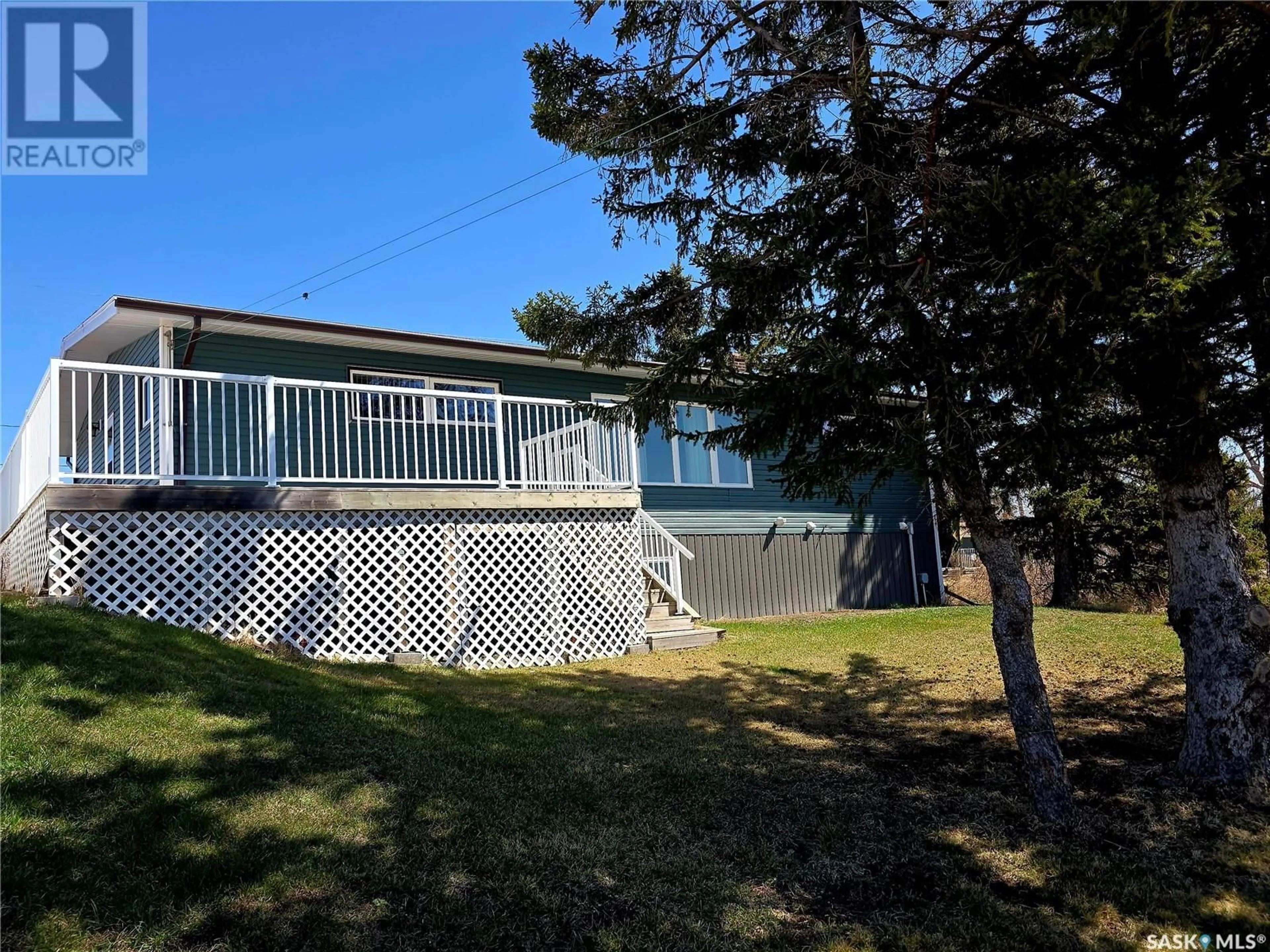 A pic from outside/outdoor area/front of a property/back of a property/a pic from drone, water/lake/river/ocean view for 101 FRASER AVENUE, Oxbow Saskatchewan S0C0B6