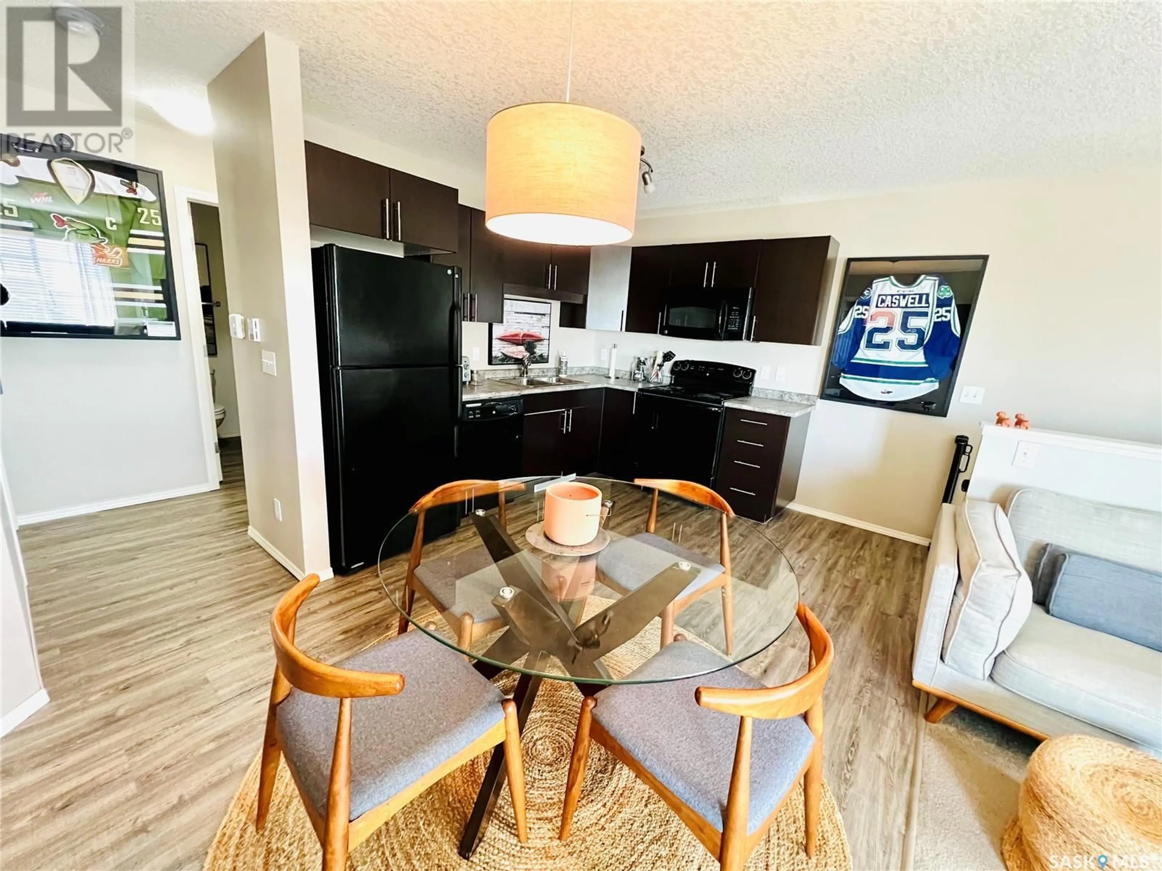 Open concept kitchen, wood/laminate floor for 122 700 BATTLEFORD TRAIL, Swift Current Saskatchewan S9H4V9