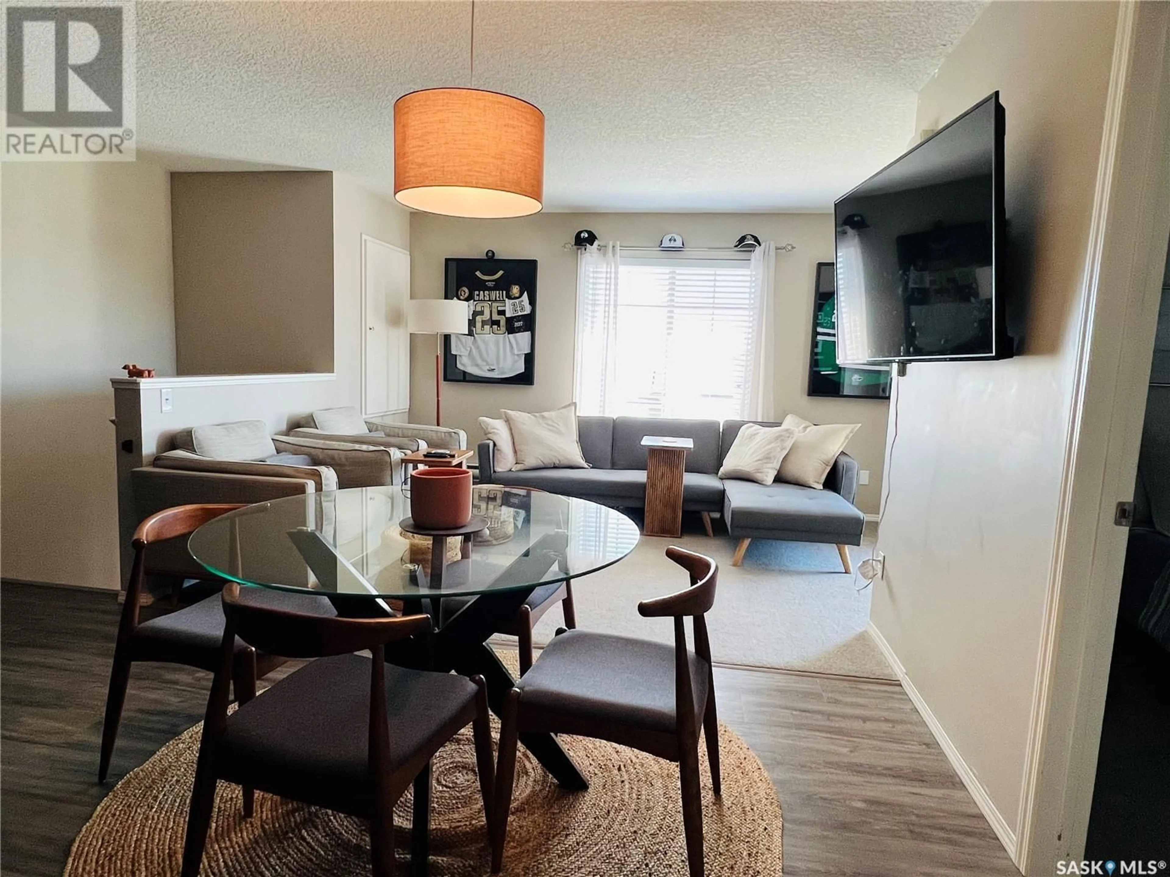 Living room with furniture, wood/laminate floor for 122 700 BATTLEFORD TRAIL, Swift Current Saskatchewan S9H4V9