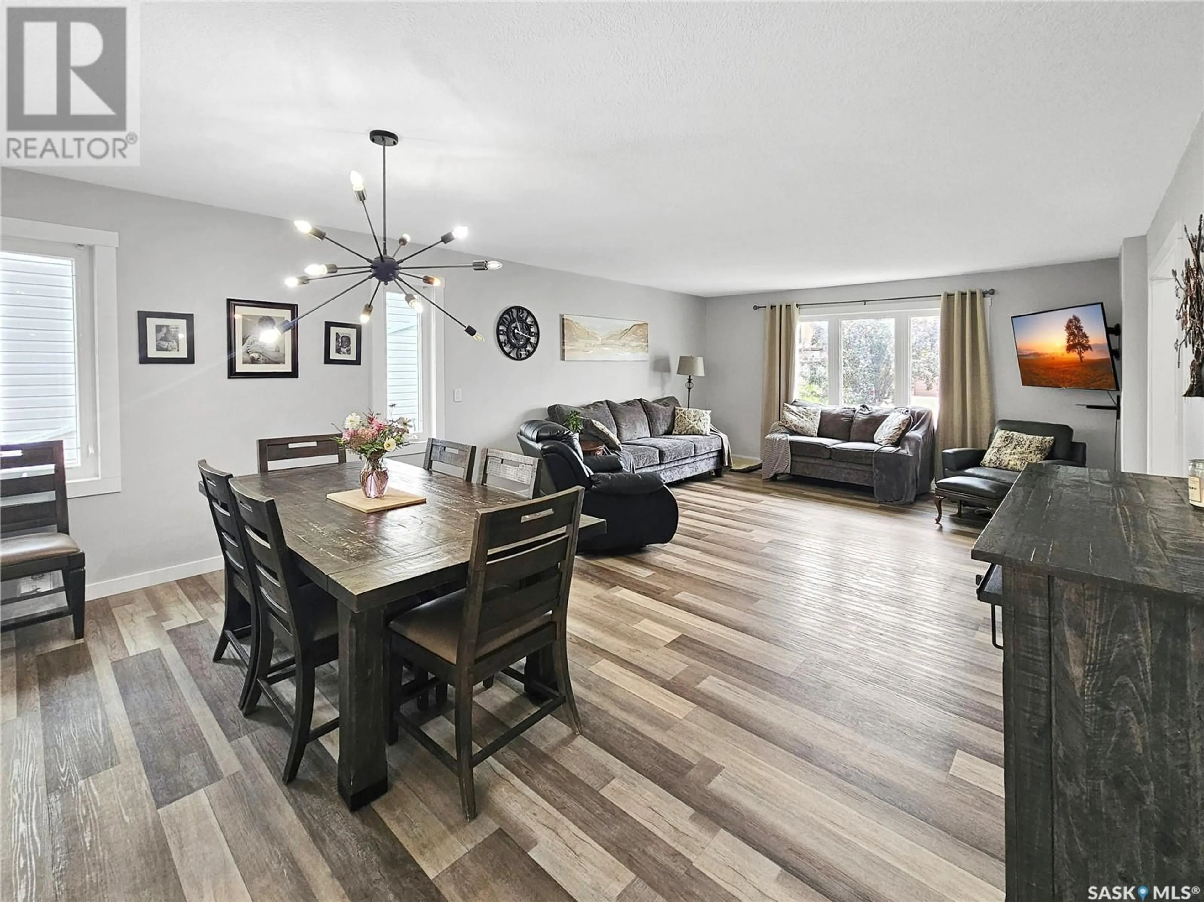 Living room with furniture, wood/laminate floor for 519 PALLISER DRIVE, Swift Current Saskatchewan S9H5C5