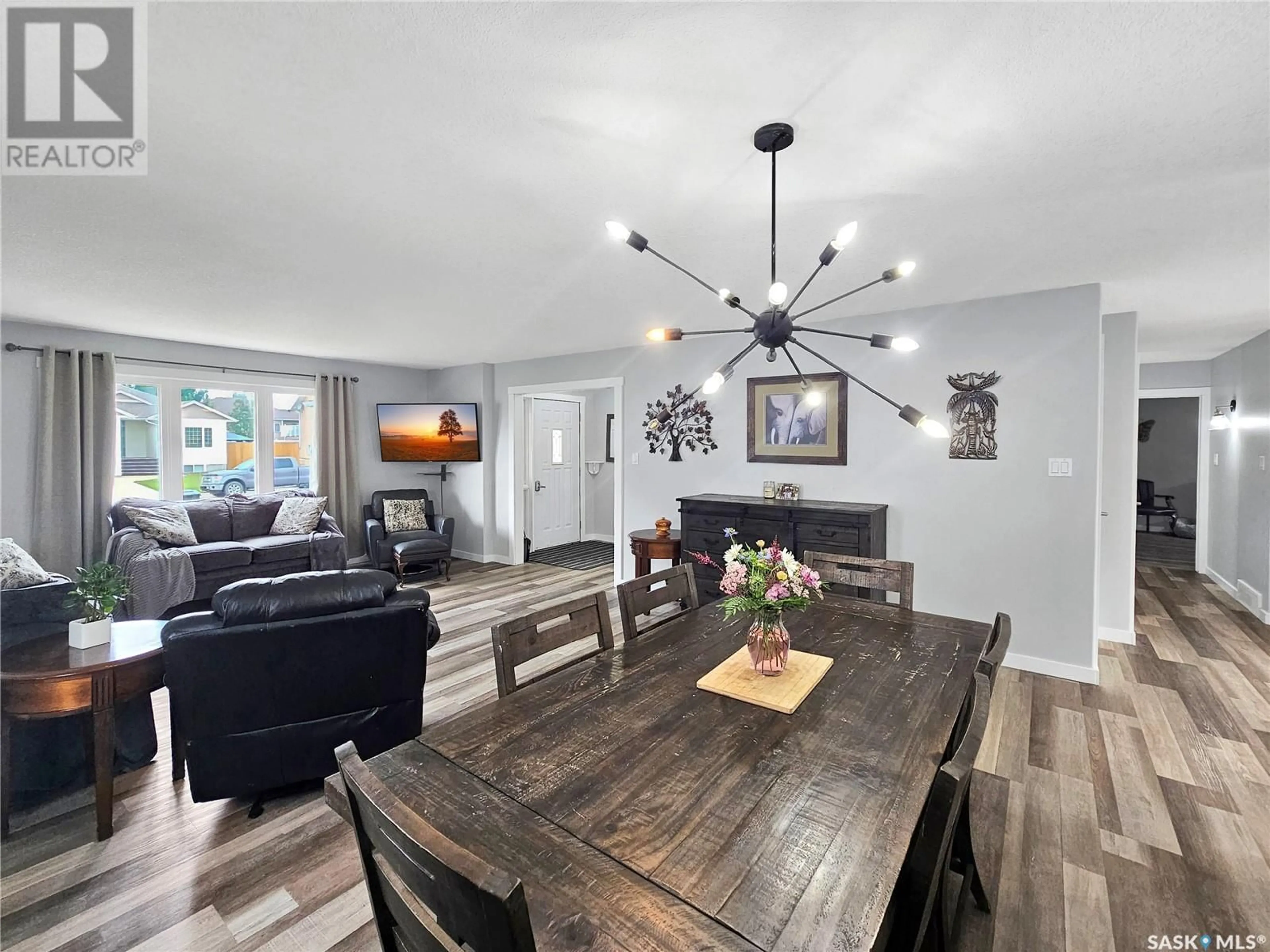 Open concept kitchen, wood/laminate floor for 519 PALLISER DRIVE, Swift Current Saskatchewan S9H5C5