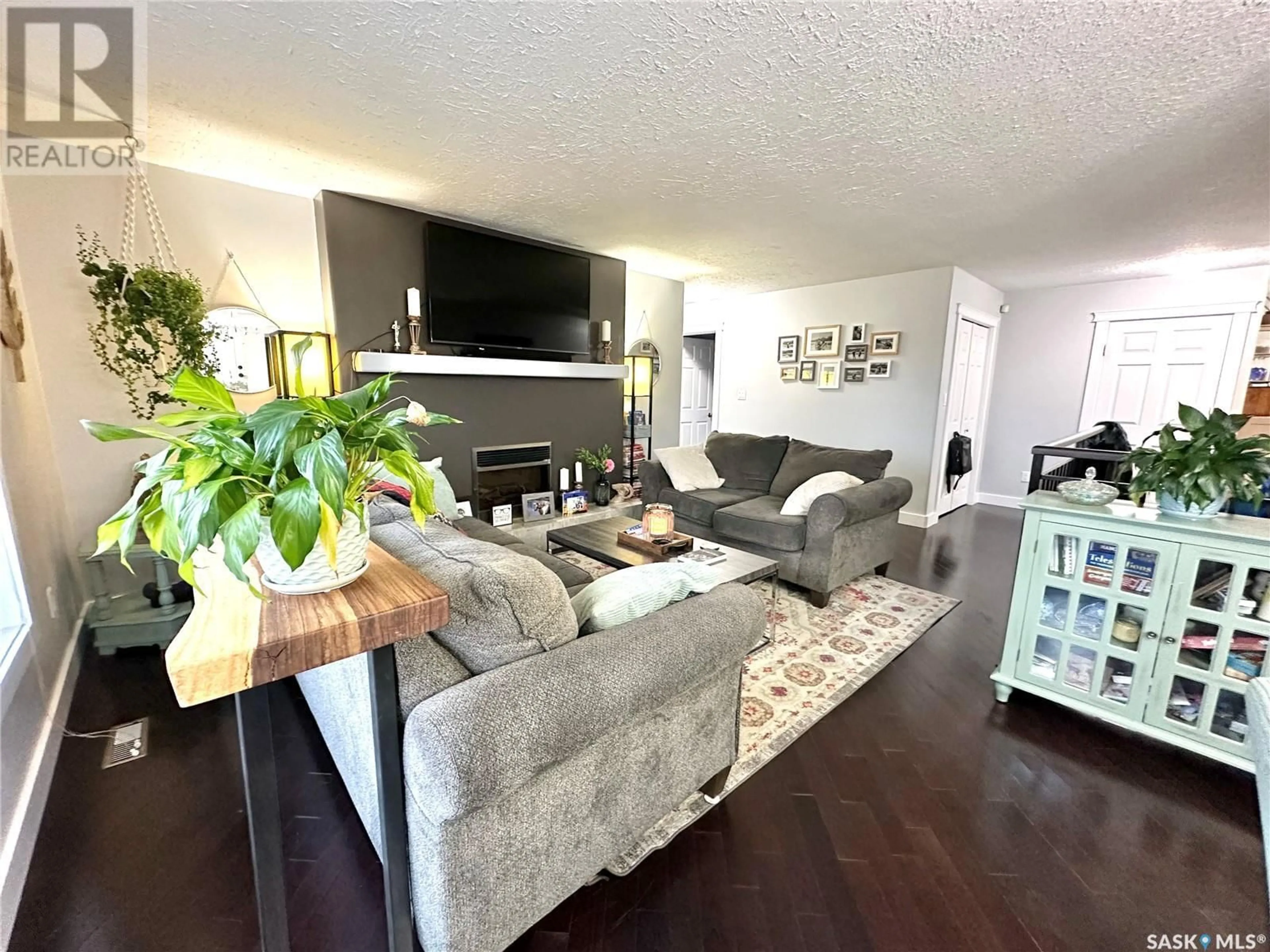 Living room with furniture, wood/laminate floor for 61 RIVERBEND CRESCENT, Battleford Saskatchewan S0M0E0