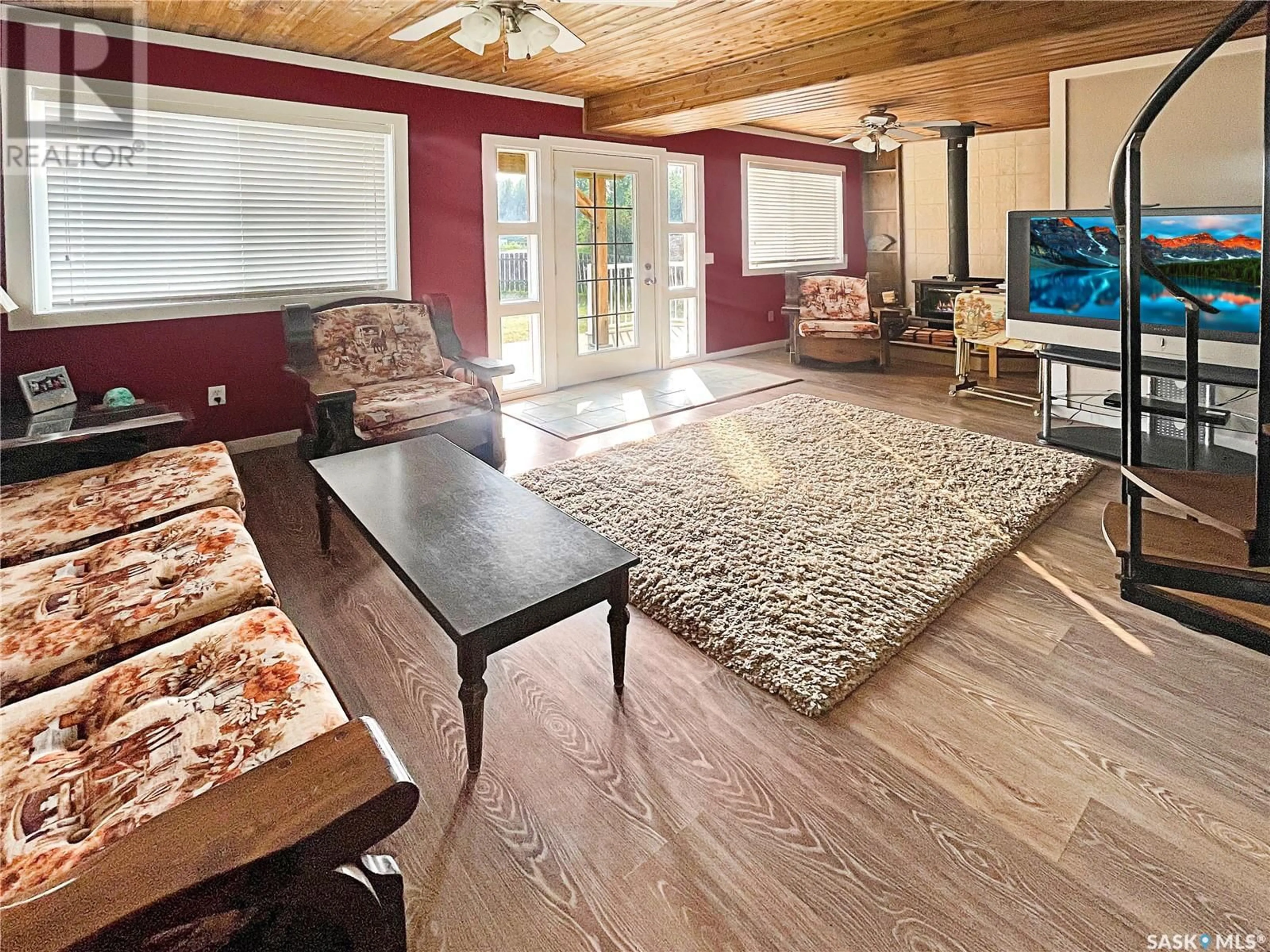 Living room with furniture, wood/laminate floor for 201 & 202 ELIM DRIVE, Lac Pelletier Saskatchewan S0N2Y0