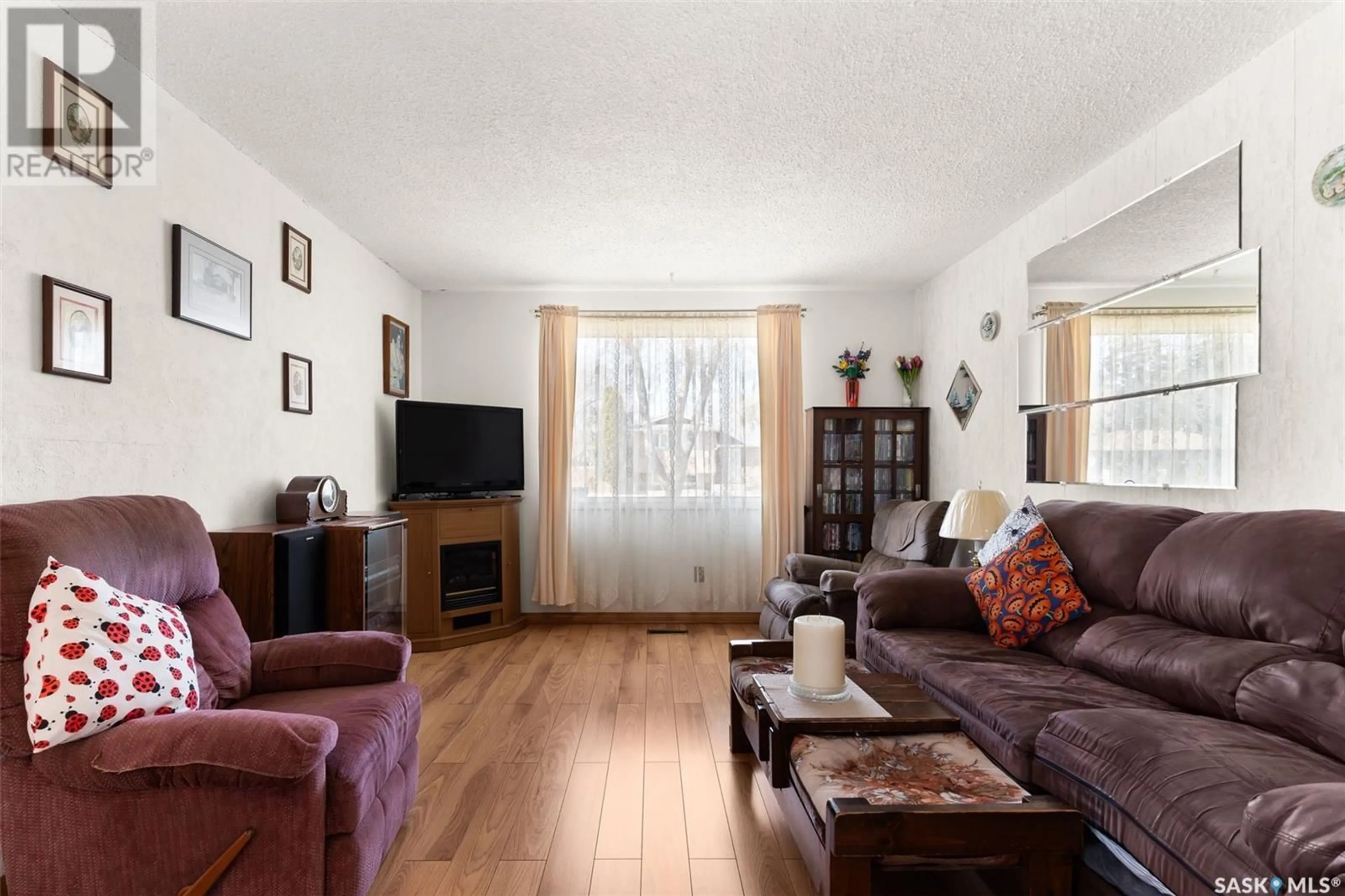 Living room with furniture, wood/laminate floor for 2335 DEWDNEY AVENUE, Regina Saskatchewan S4N4C4