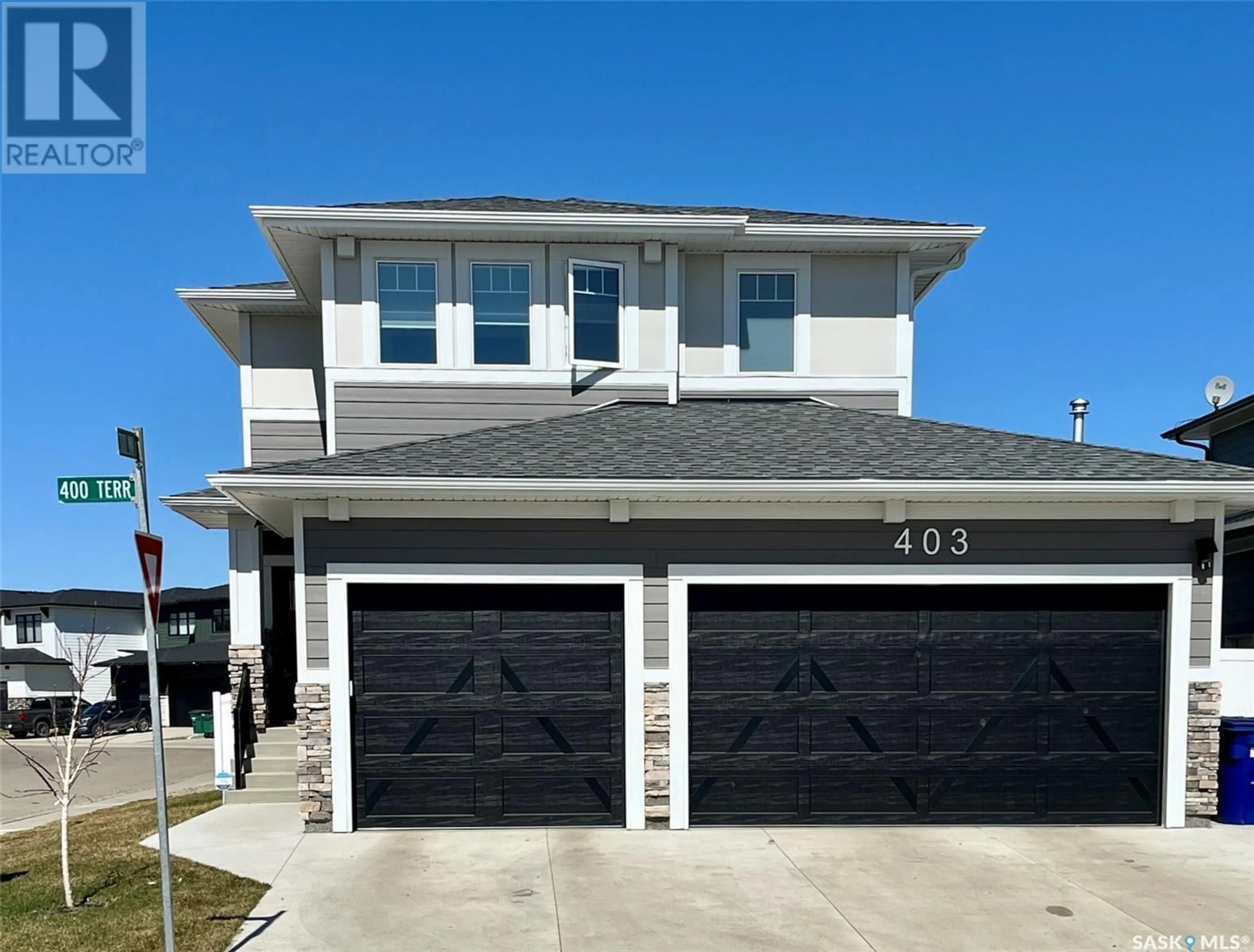 Home with vinyl exterior material, street for 403 DUBOIS TERRACE, Saskatoon Saskatchewan S0K2T0