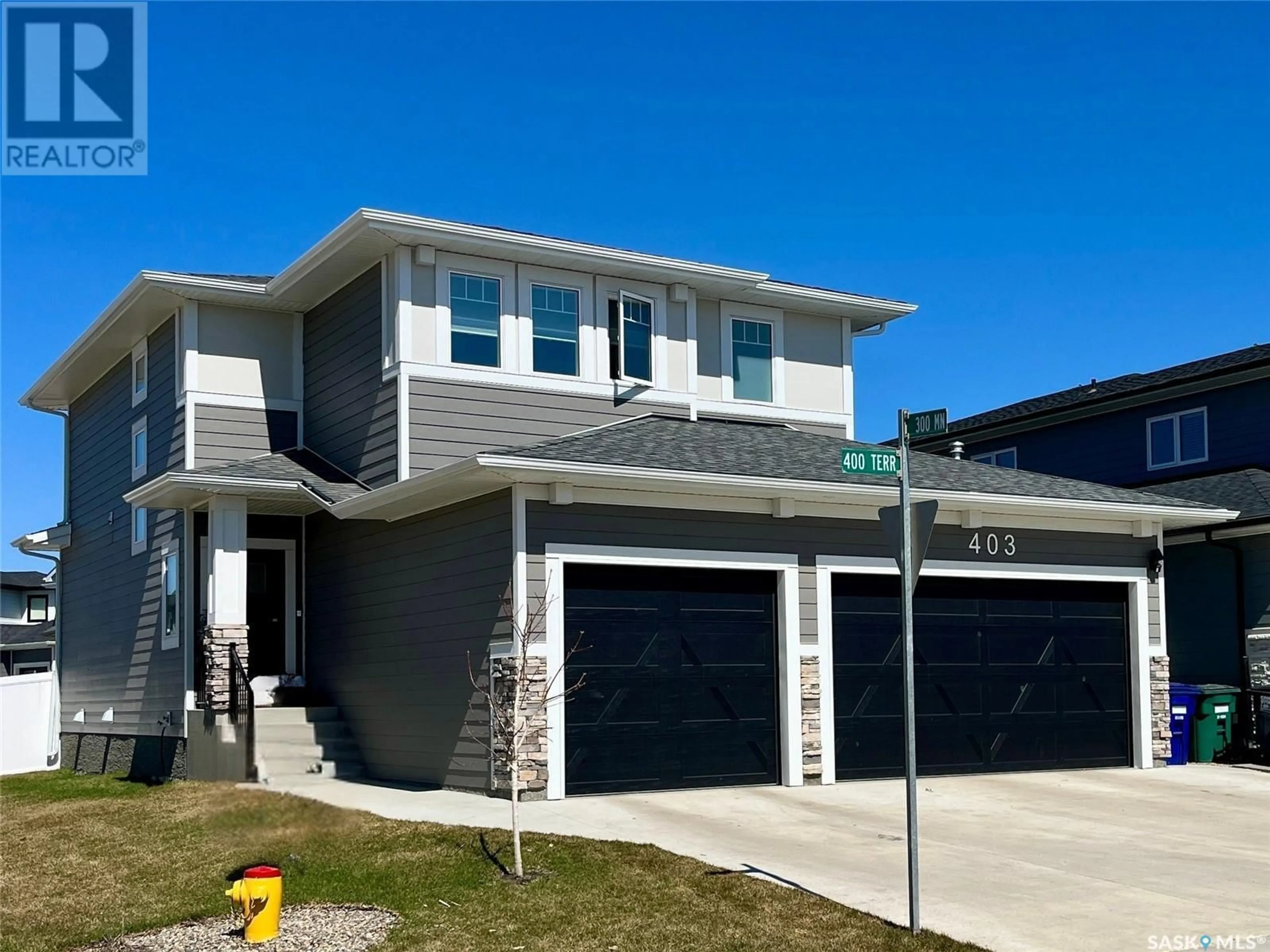 Home with vinyl exterior material, street for 403 DUBOIS TERRACE, Saskatoon Saskatchewan S0K2T0