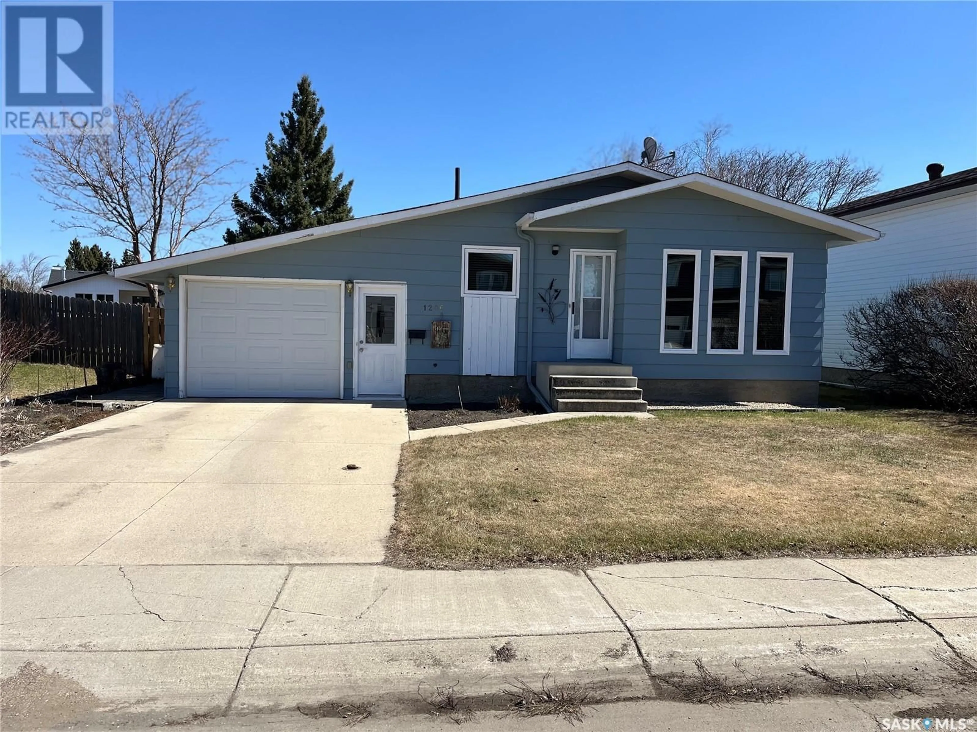 Home with vinyl exterior material, street for 1206 CENTENNIAL PLACE, Humboldt Saskatchewan S0K2A0