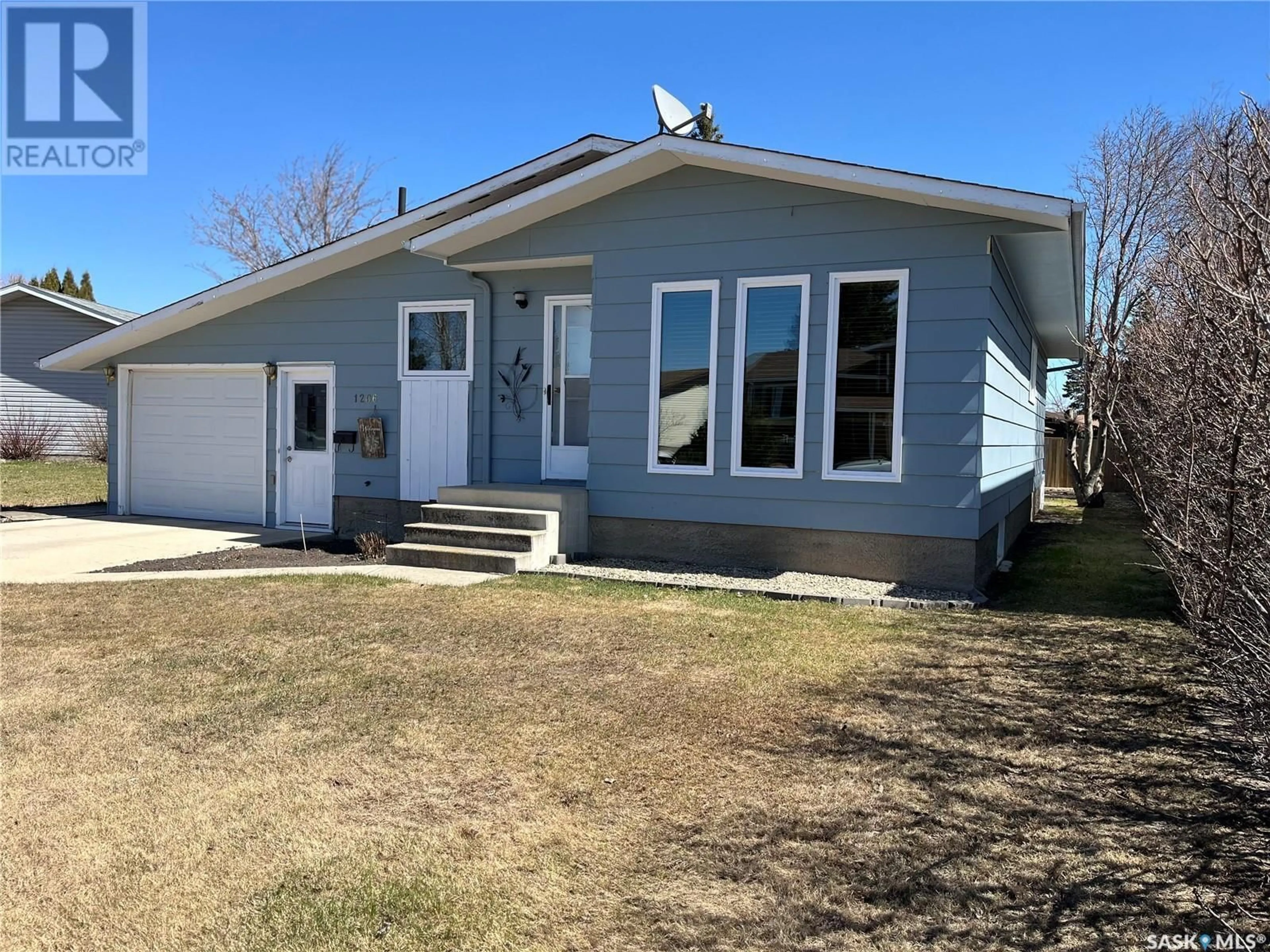 Home with vinyl exterior material, street for 1206 CENTENNIAL PLACE, Humboldt Saskatchewan S0K2A0