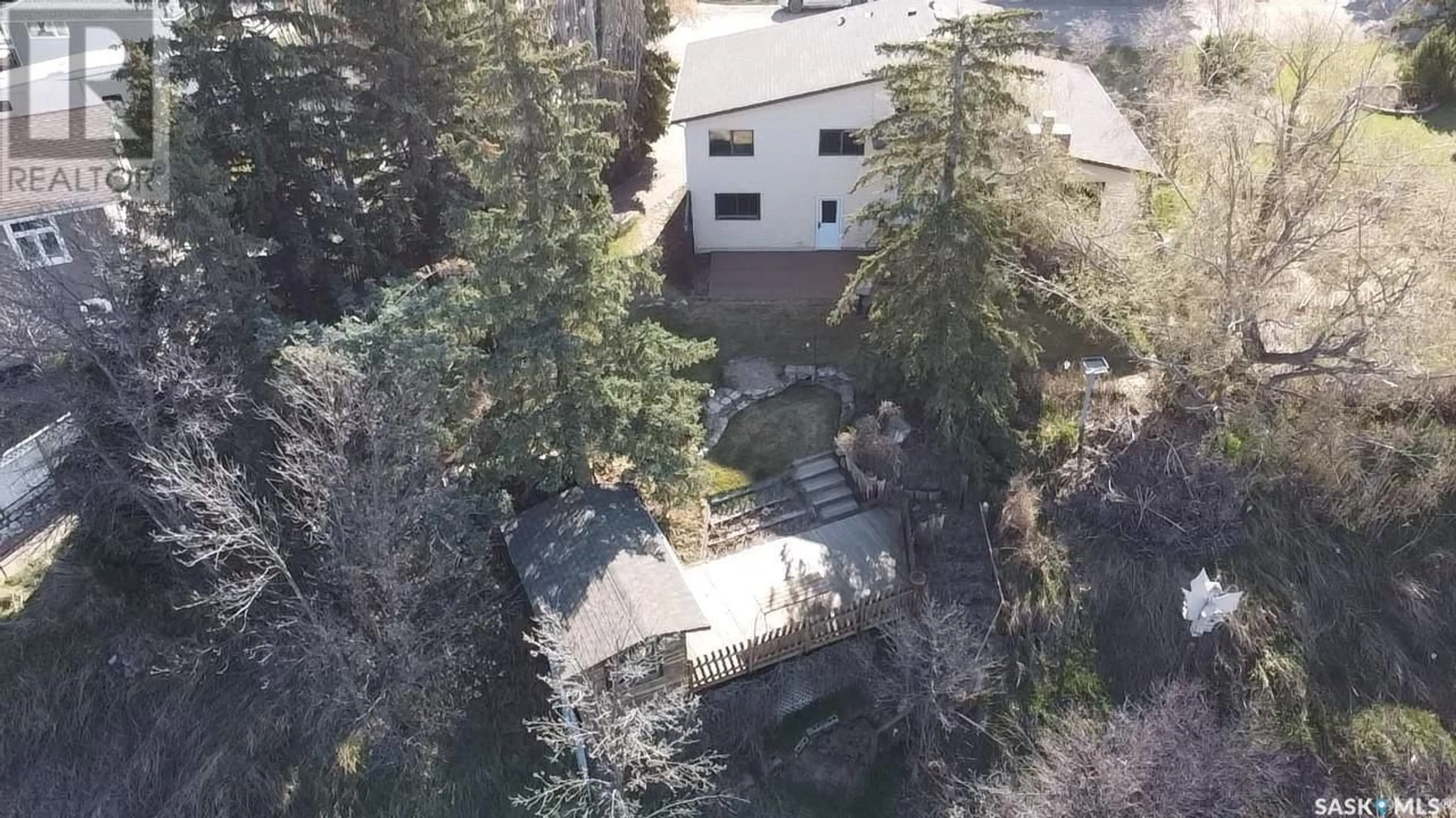 A pic from outside/outdoor area/front of a property/back of a property/a pic from drone, mountain view for 13 CARTER CRESCENT, Outlook Saskatchewan S0L2N0