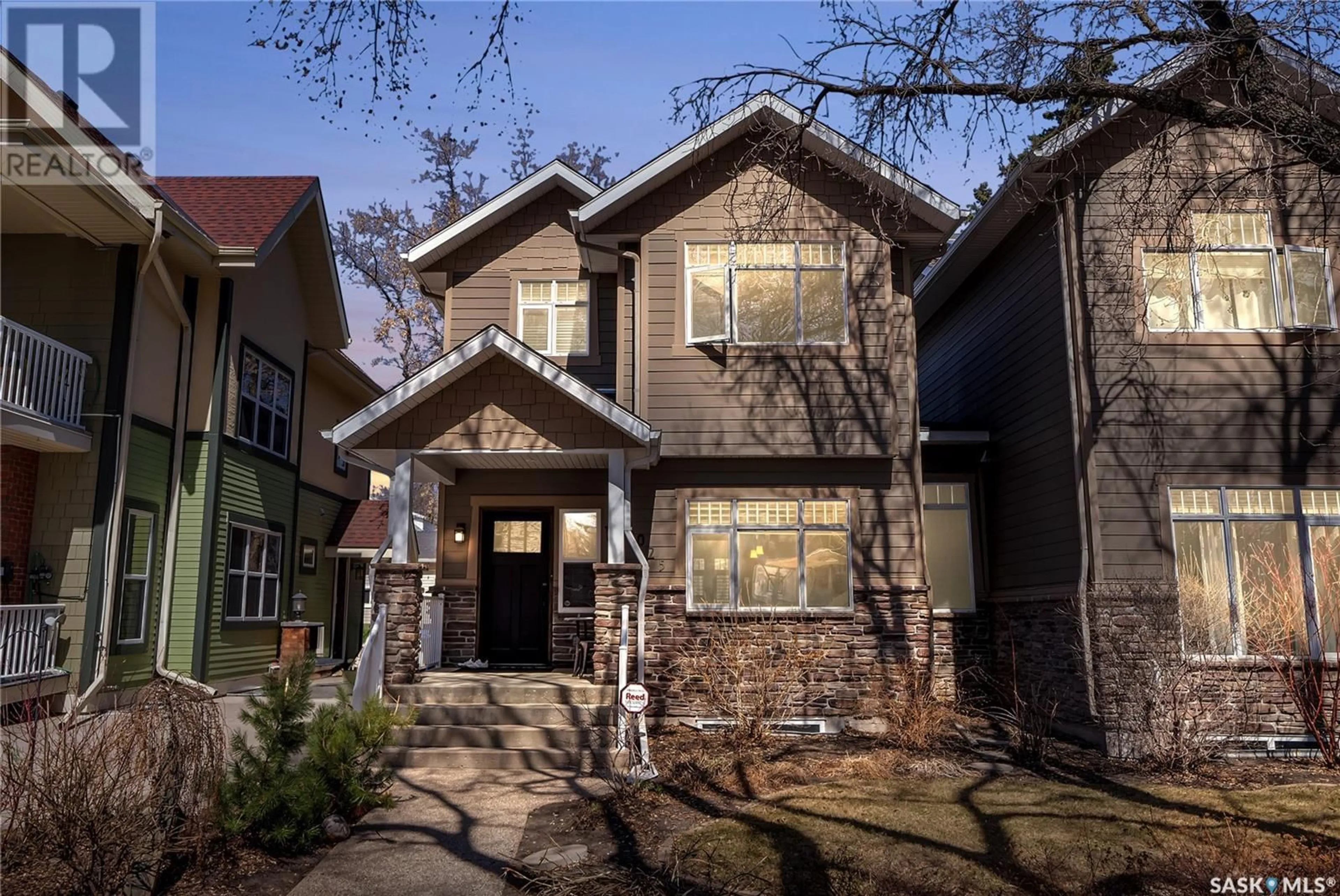 Home with brick exterior material, street for 1025 10TH STREET, Saskatoon Saskatchewan S7H0H8
