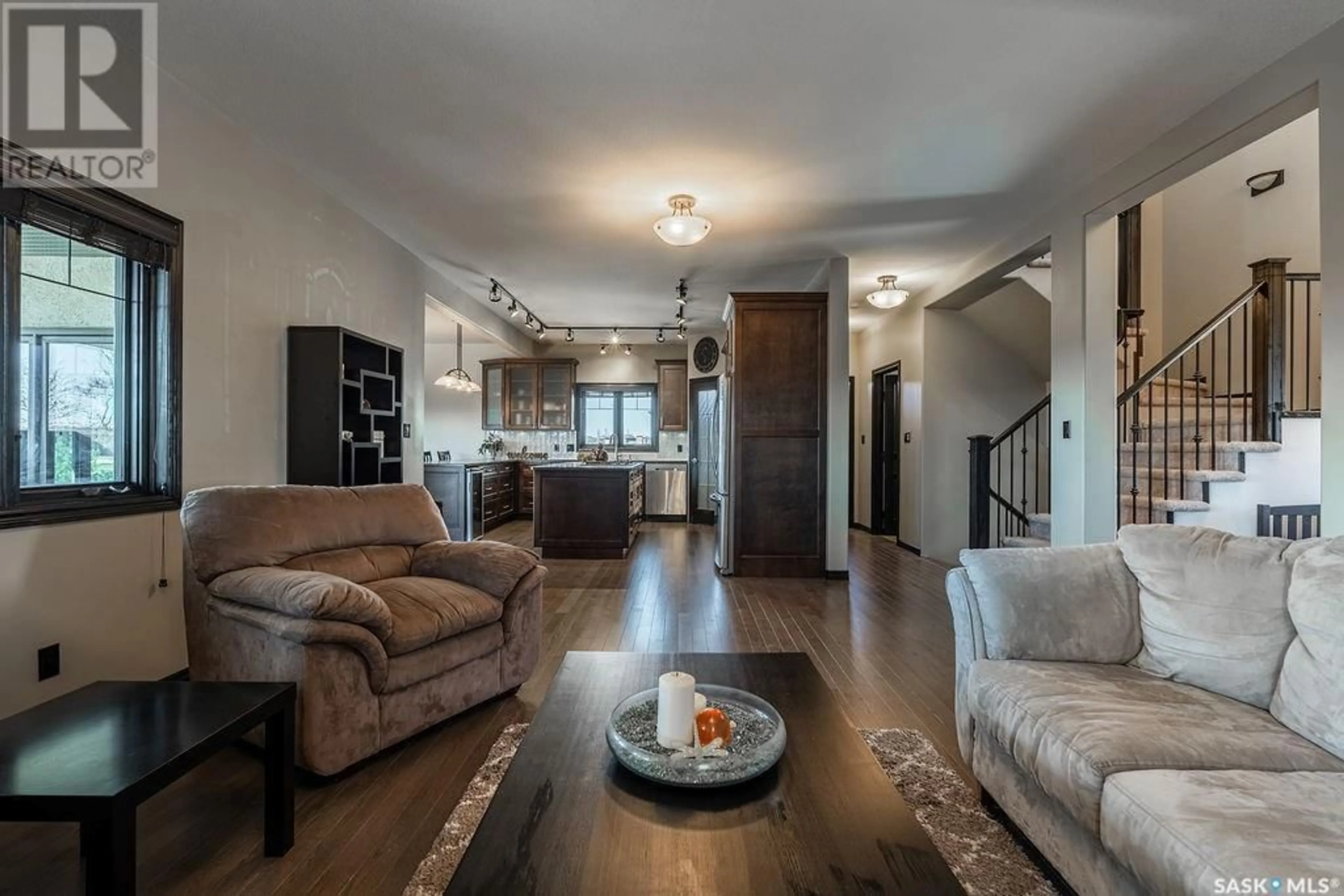 Living room with furniture, wood/laminate floor for 330 GREENFIELD TERRACE, Saskatoon Saskatchewan S7R0B7