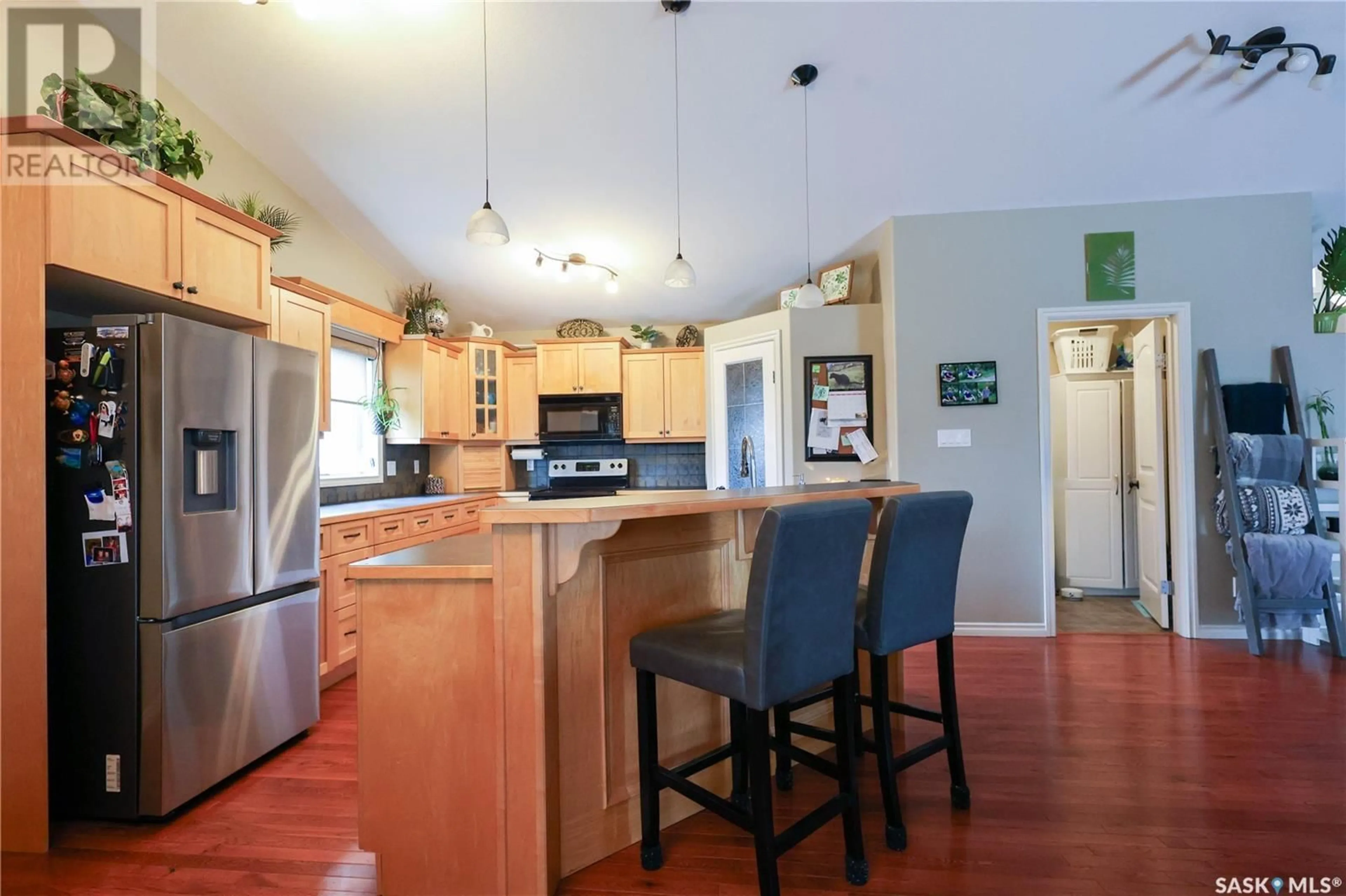 Open concept kitchen, wood/laminate floor for 214 LAKERIDGE DRIVE, Buckland Rm No. 491 Saskatchewan S6V5R3