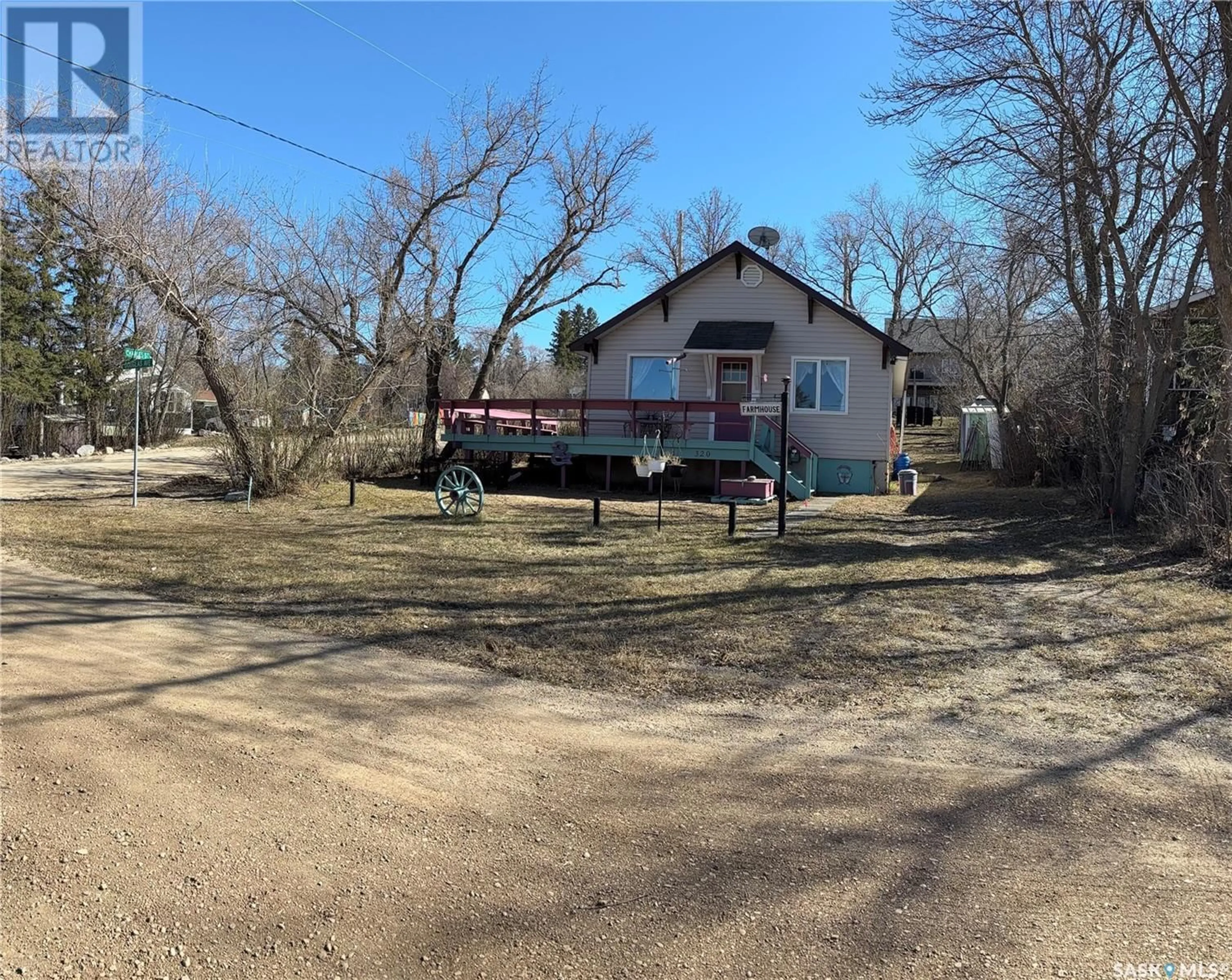 A pic from outside/outdoor area/front of a property/back of a property/a pic from drone, street for 320 DOUGLAS AVENUE, Manitou Beach Saskatchewan S0K4T1