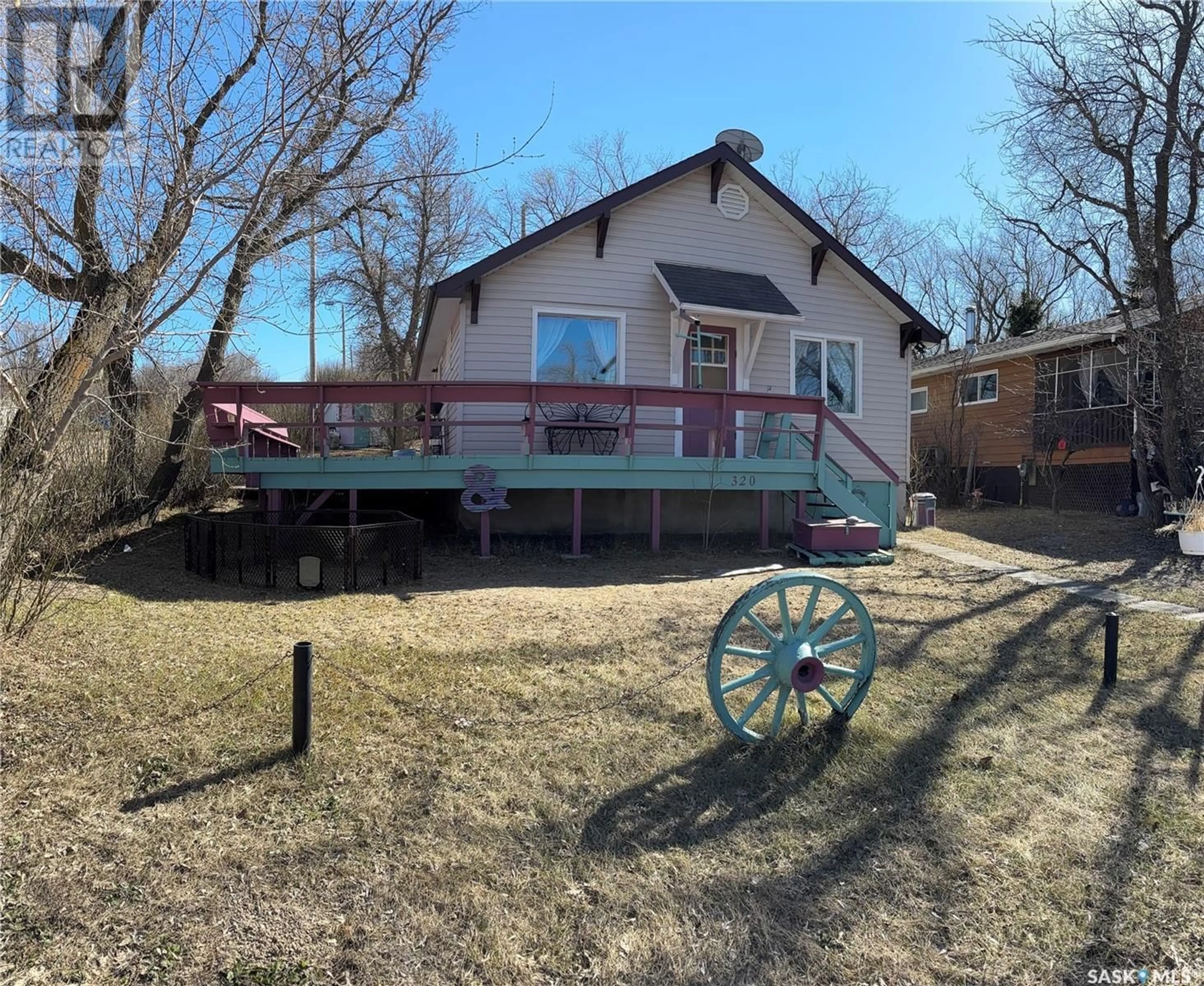 A pic from outside/outdoor area/front of a property/back of a property/a pic from drone, street for 320 DOUGLAS AVENUE, Manitou Beach Saskatchewan S0K4T1