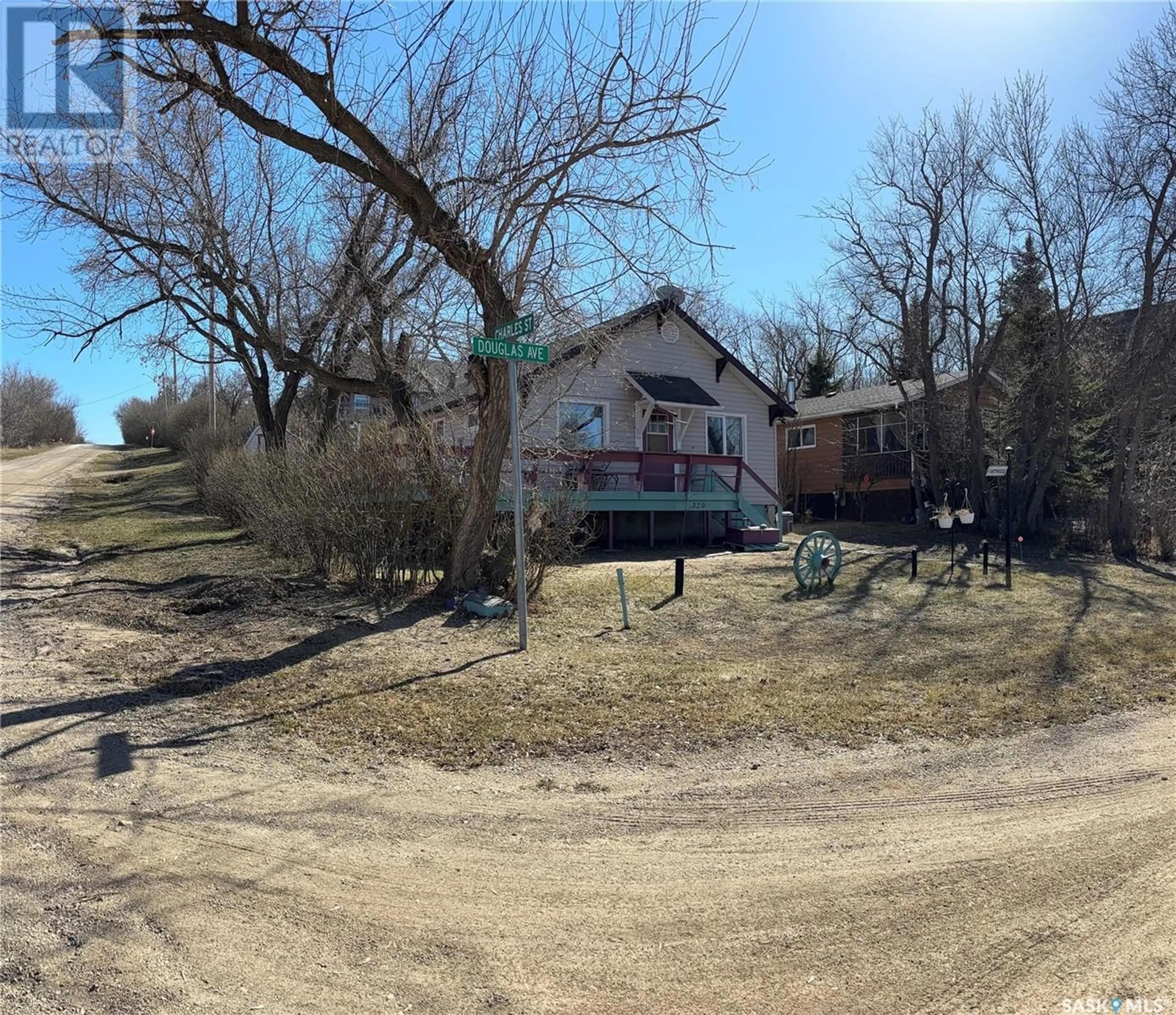 A pic from outside/outdoor area/front of a property/back of a property/a pic from drone, street for 320 DOUGLAS AVENUE, Manitou Beach Saskatchewan S0K4T1