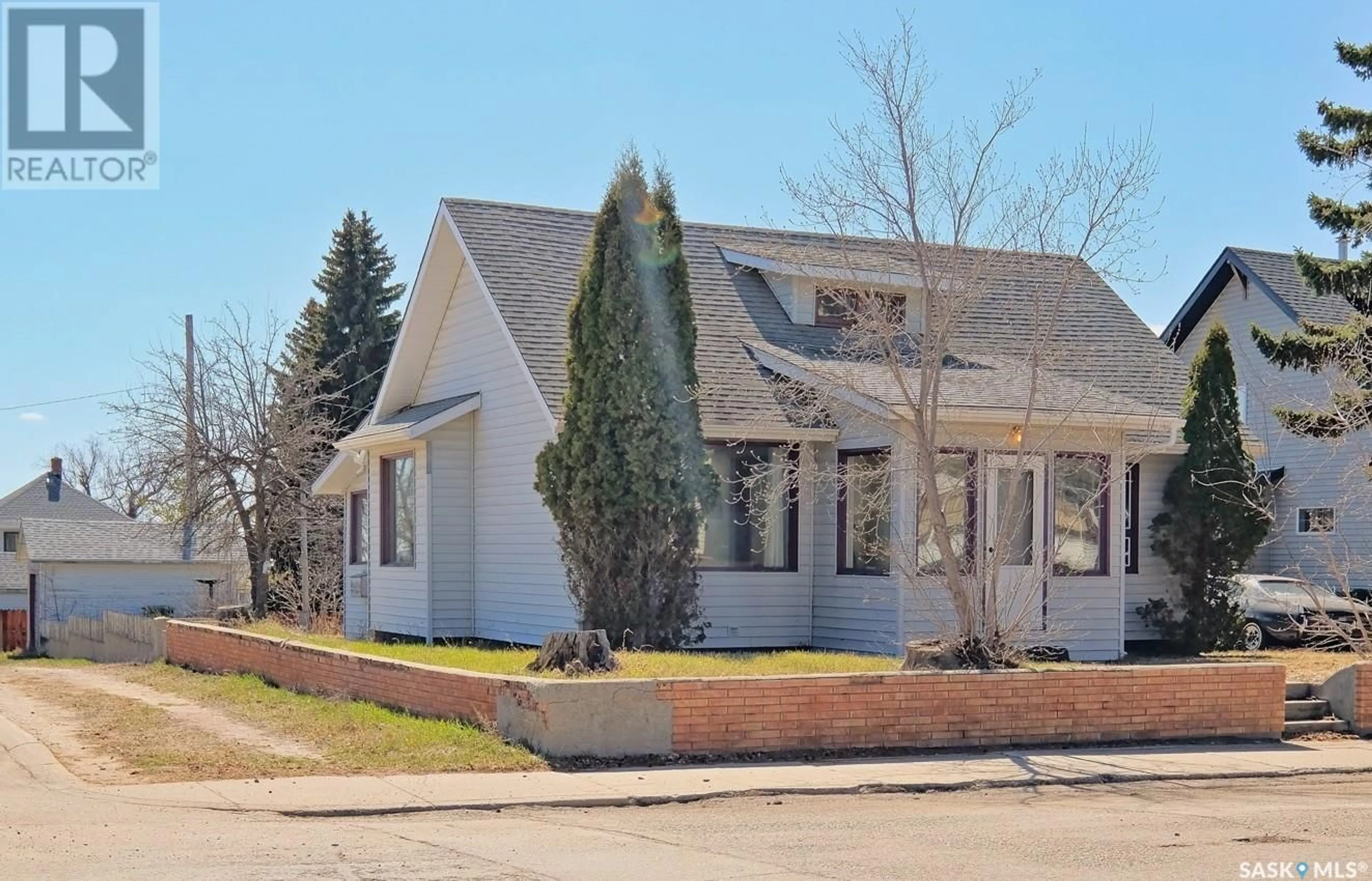 Home with brick exterior material, street for 240 3RD AVENUE, Biggar Saskatchewan S0L2V0