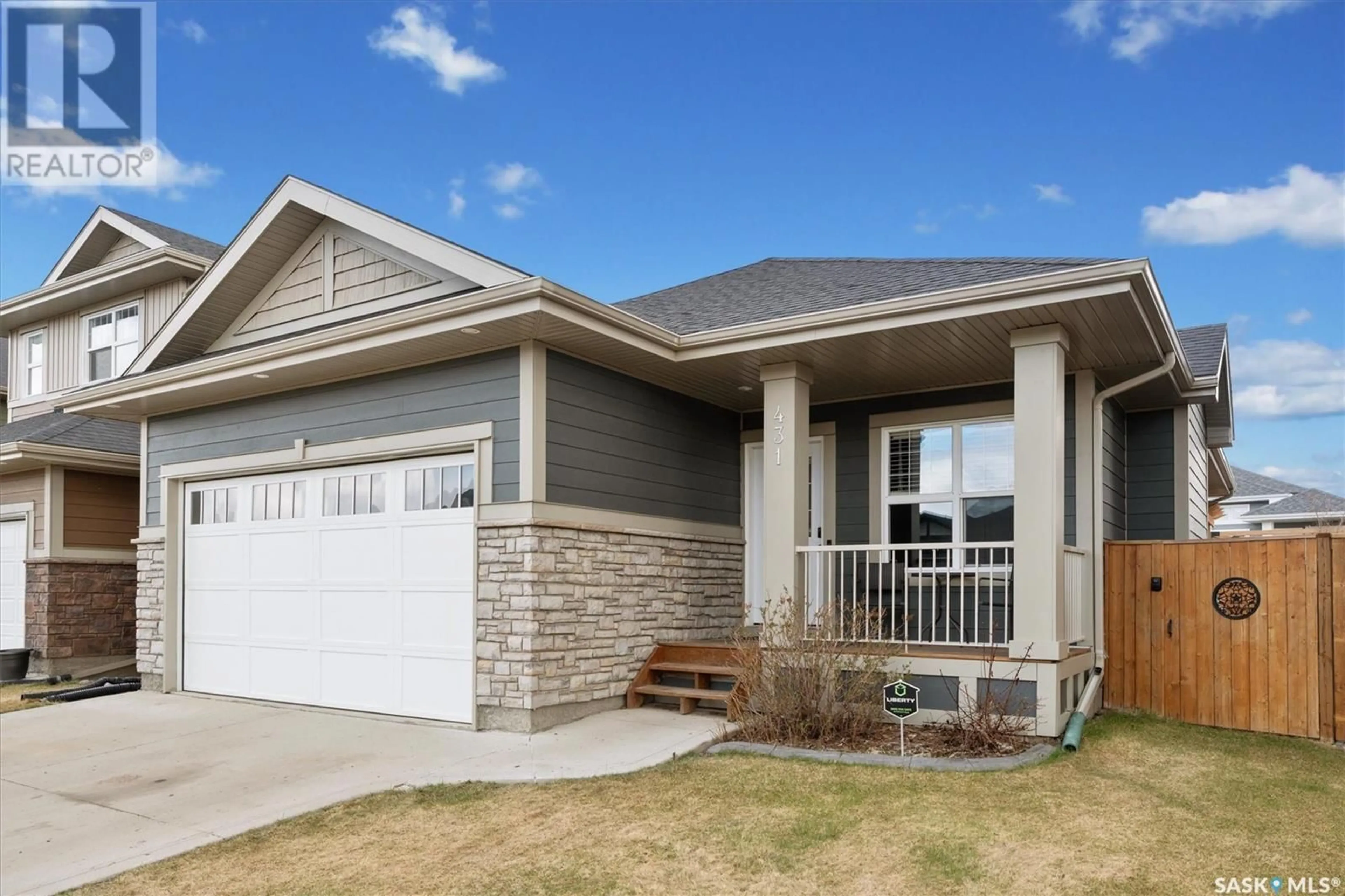 Home with vinyl exterior material, street for 431 PRITCHARD LANE, Saskatoon Saskatchewan S7V0E8