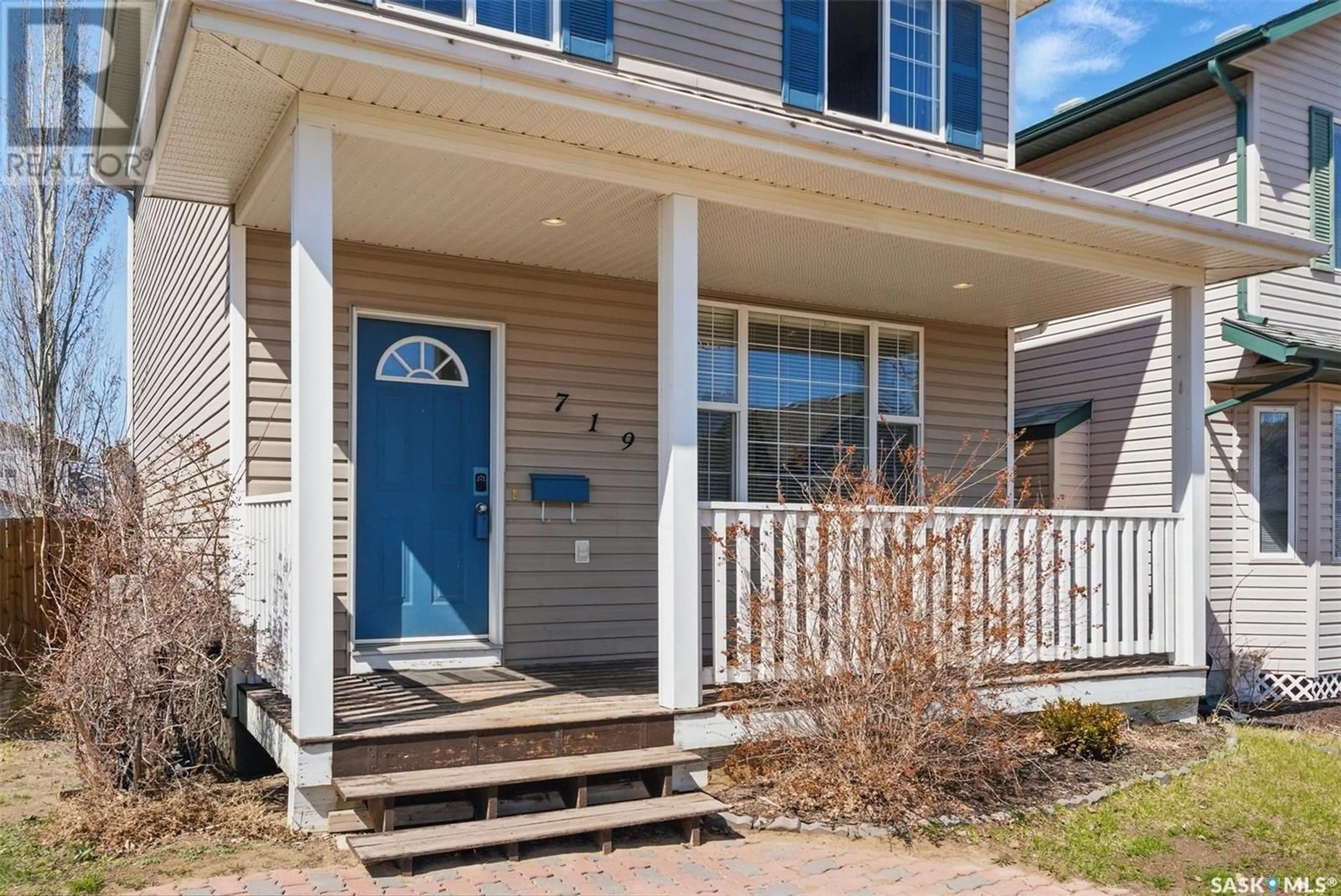 Home with vinyl exterior material, street for 719 RUTHERFORD LANE, Saskatoon Saskatchewan S7N4X8