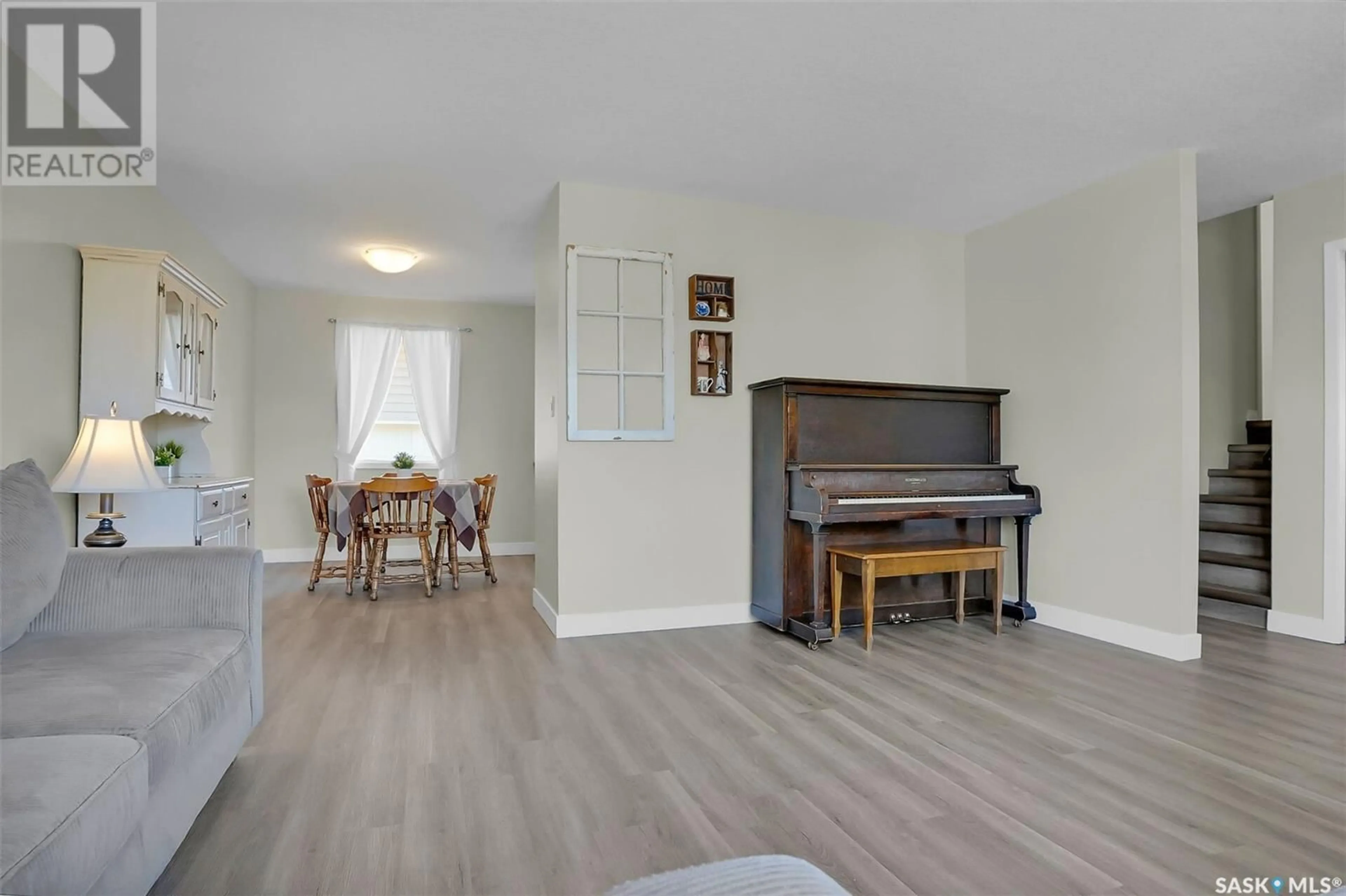 Living room with furniture, wood/laminate floor for 38 CHASE CRESCENT, Regina Saskatchewan S4R7Y4