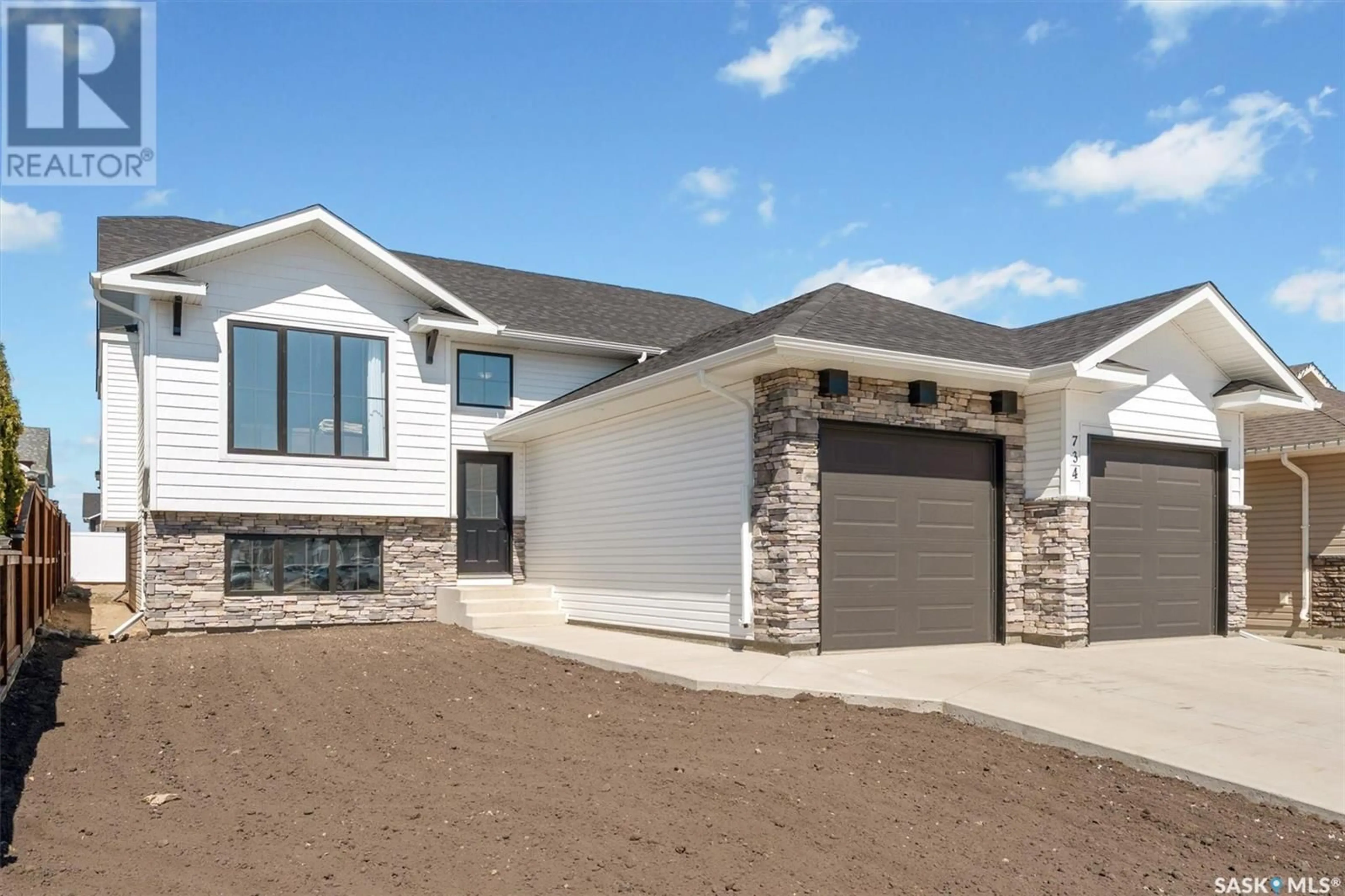 Home with vinyl exterior material, street for 734 CASPER CRESCENT, Warman Saskatchewan S0K4S0