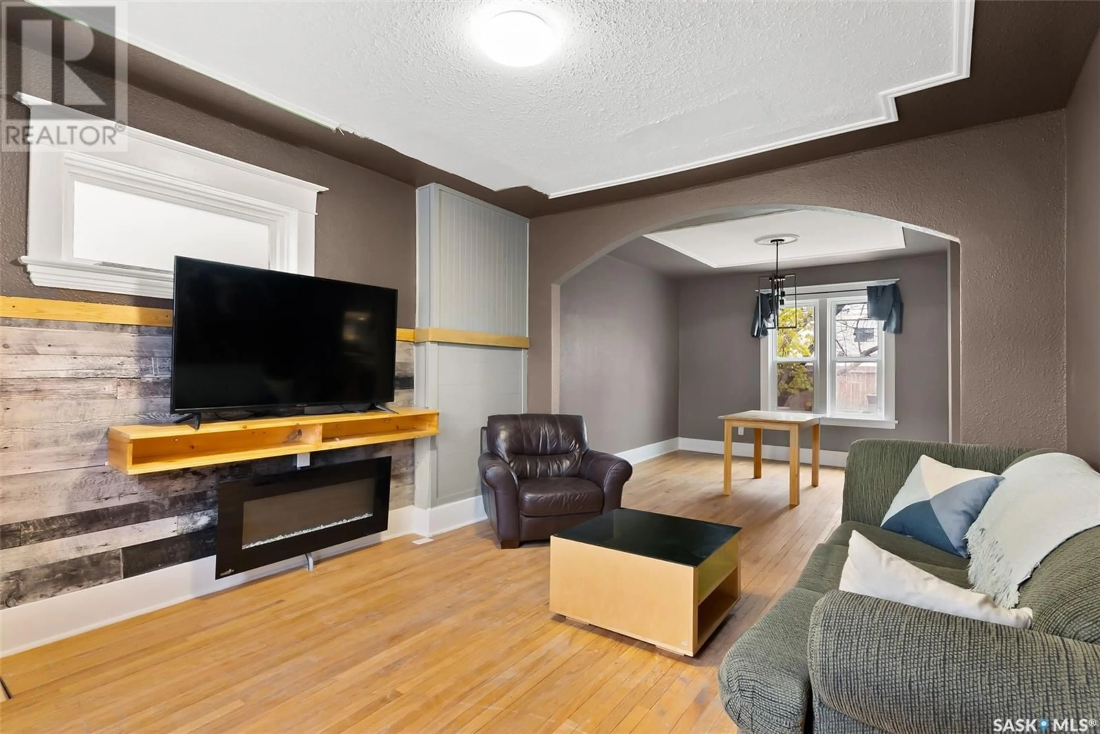 Living room with furniture, wood/laminate floor for 2108 RAE STREET, Regina Saskatchewan S4T2E7