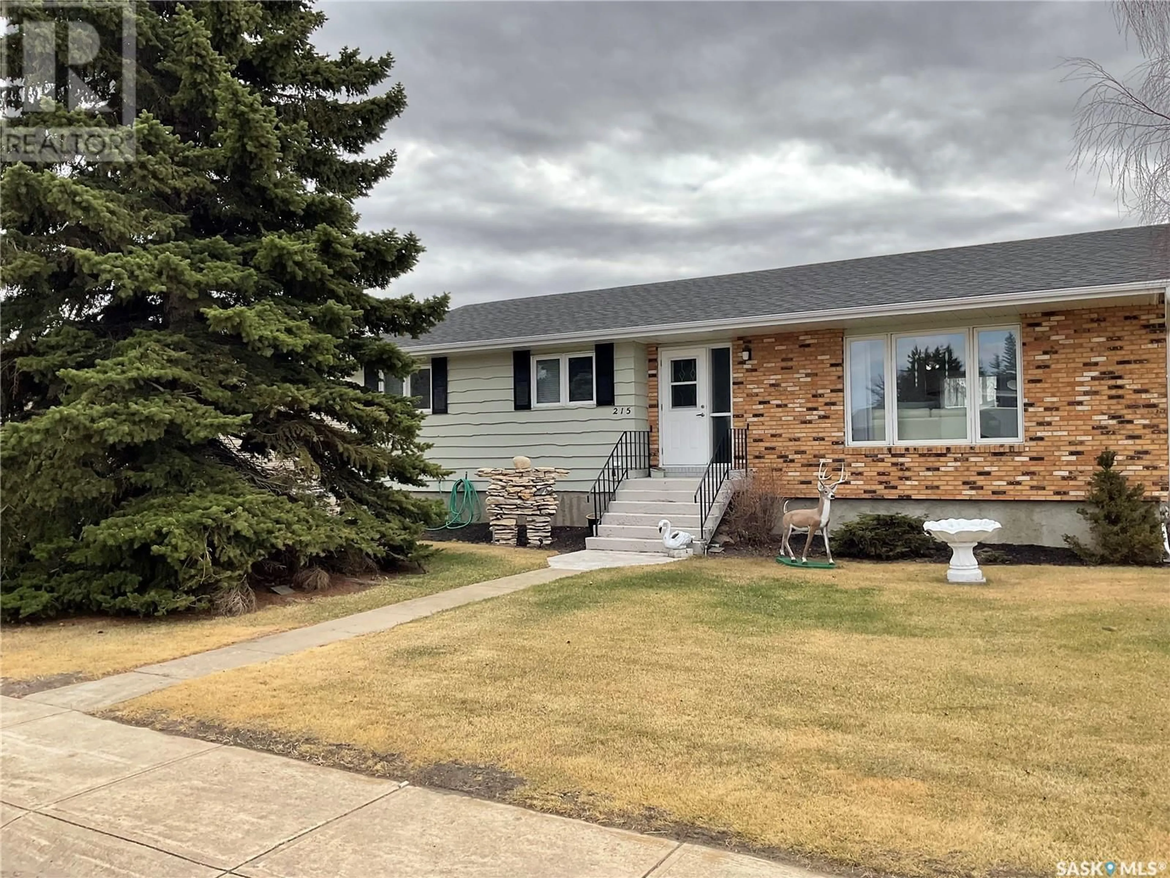 Home with vinyl exterior material, street for 215 7TH STREET, Wakaw Saskatchewan S0K4P0