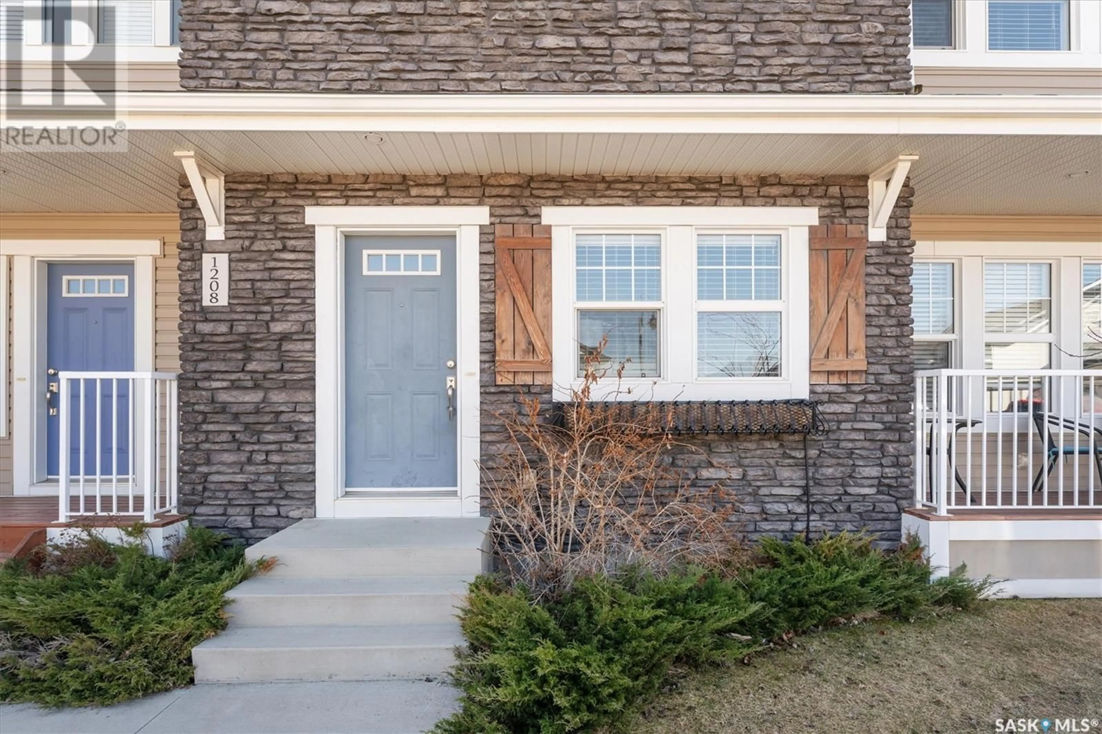 Home with brick exterior material, street for 1208 PRINGLE WAY, Saskatoon Saskatchewan S7T0X5