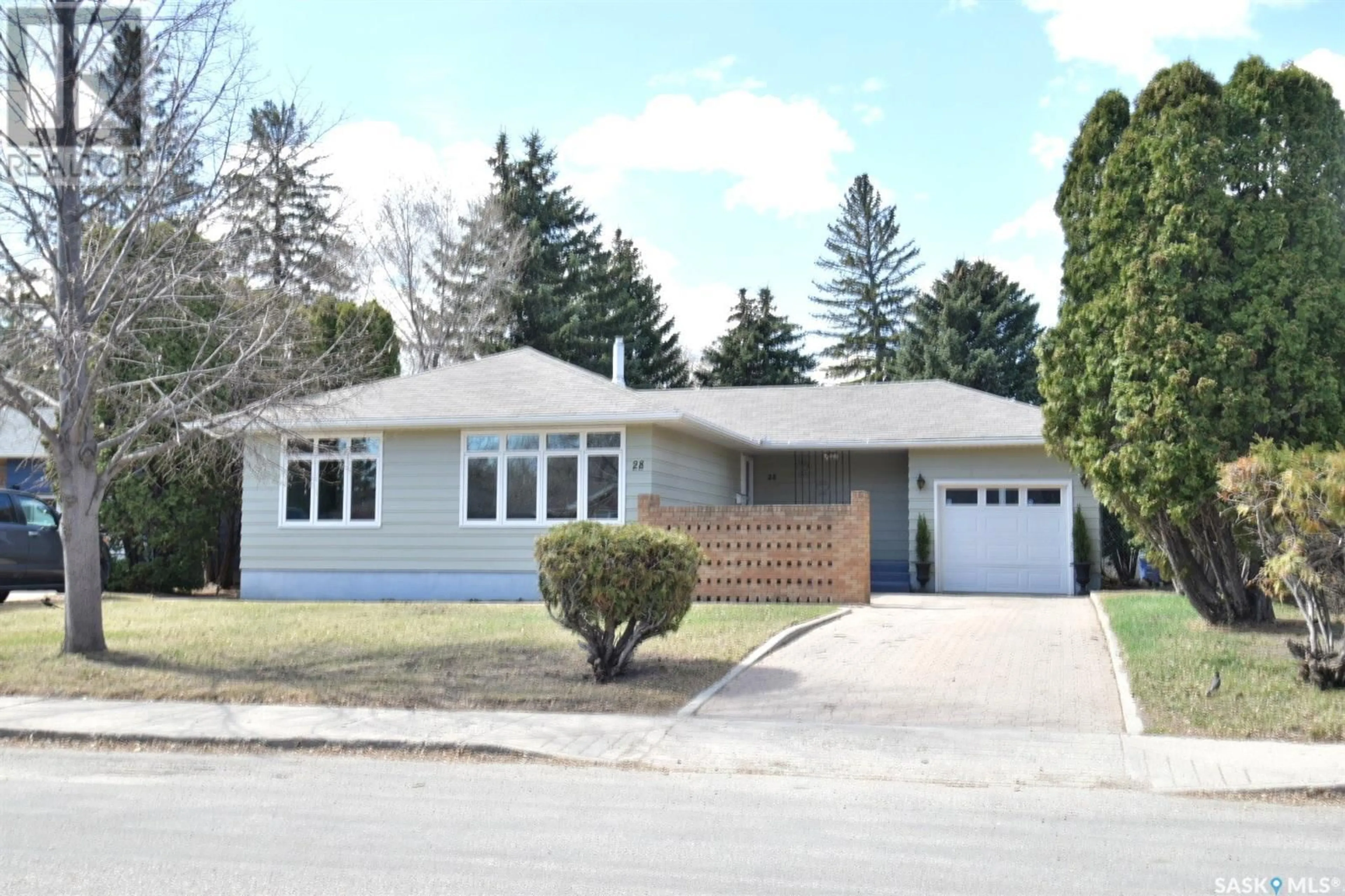 Home with vinyl exterior material, street for 28 HARRISON CRESCENT, Saskatoon Saskatchewan S7H1H5