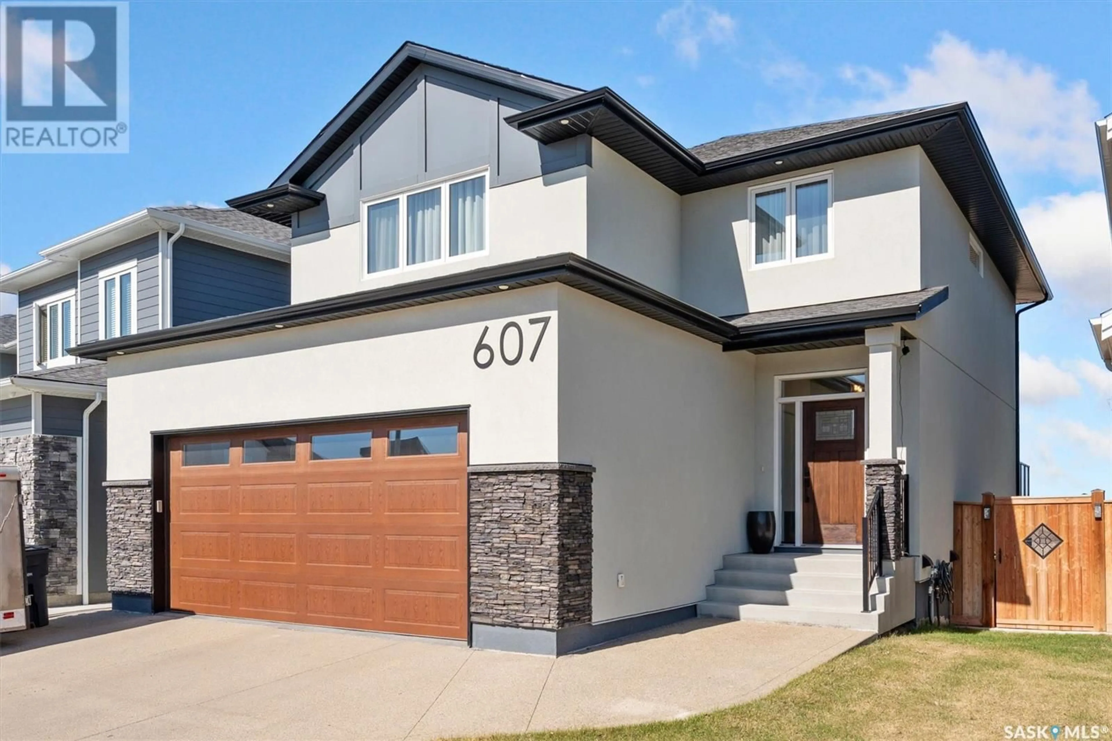 Home with brick exterior material, street for 607 FAST CRESCENT, Saskatoon Saskatchewan S7W0X1