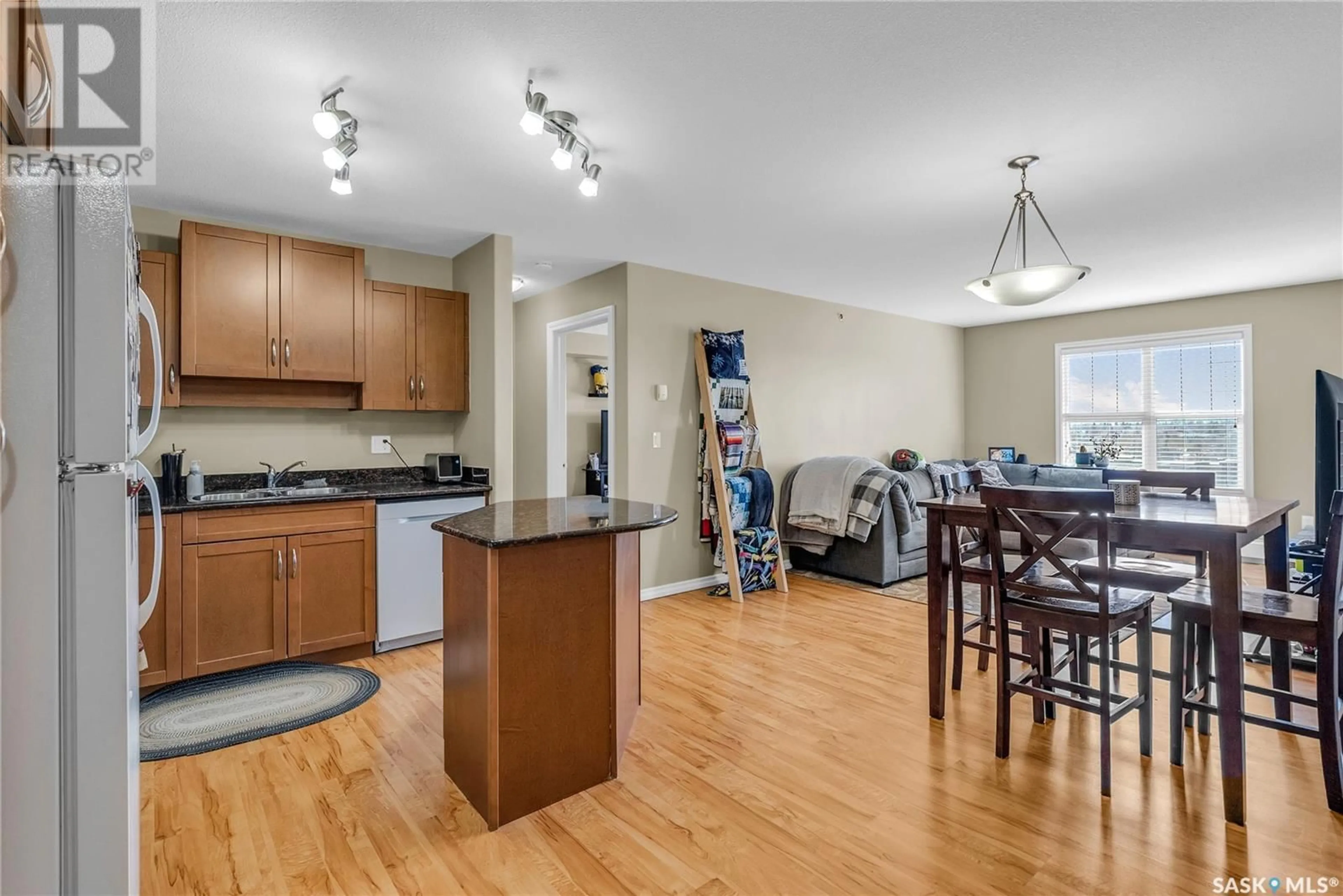 Open concept kitchen, wood/laminate floor for 326 - 307 HEROLD ROAD, Saskatoon Saskatchewan S7V1H9