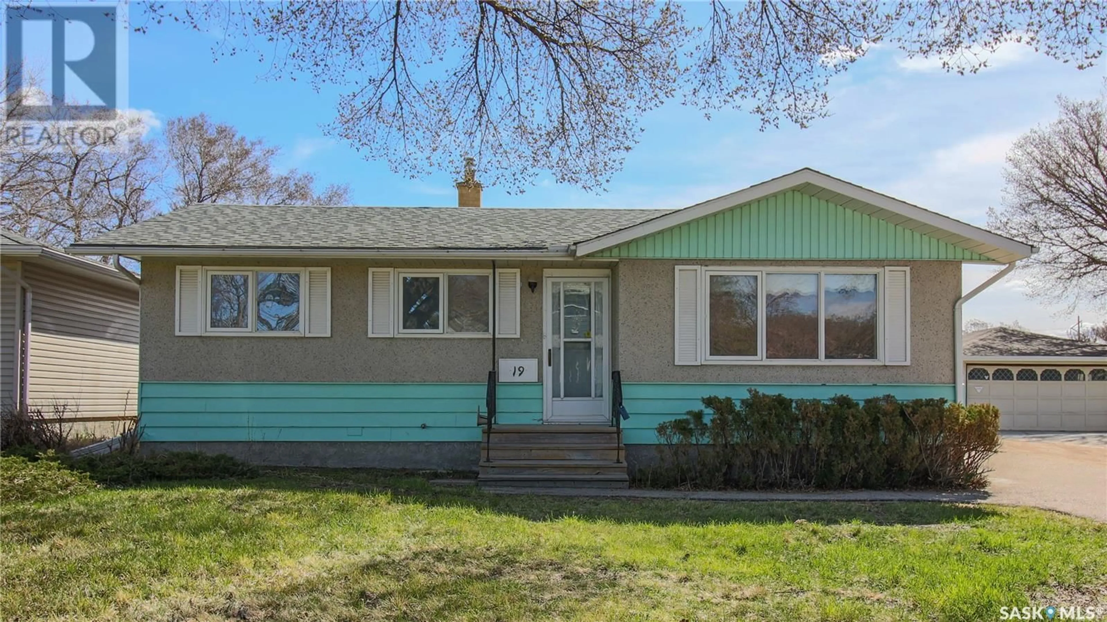 Home with vinyl exterior material, street for 19 MERLIN CRESCENT, Regina Saskatchewan S4R3E7