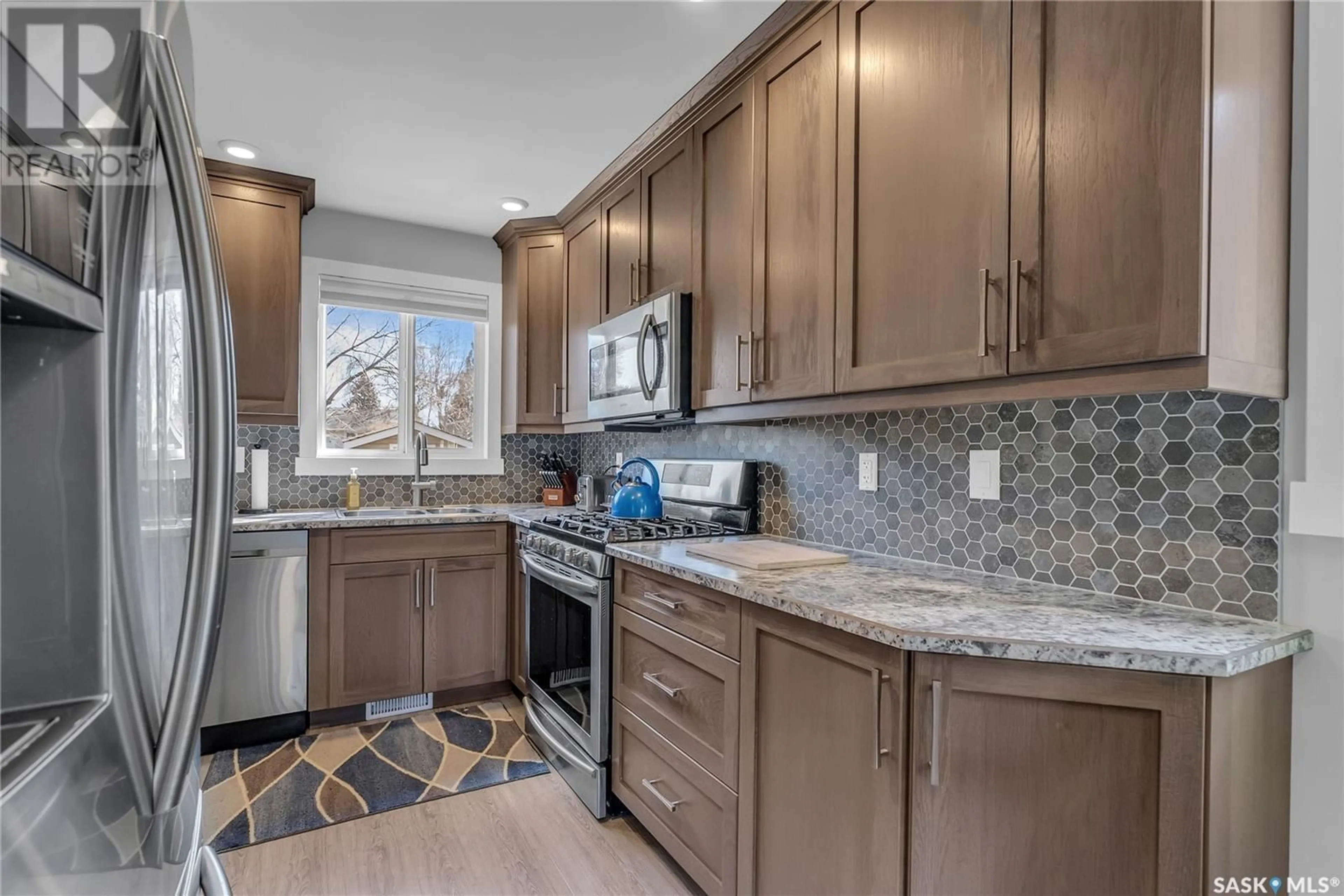 Open concept kitchen, ceramic/tile floor for 445 MCMASTER CRESCENT, Saskatoon Saskatchewan S7H4E8
