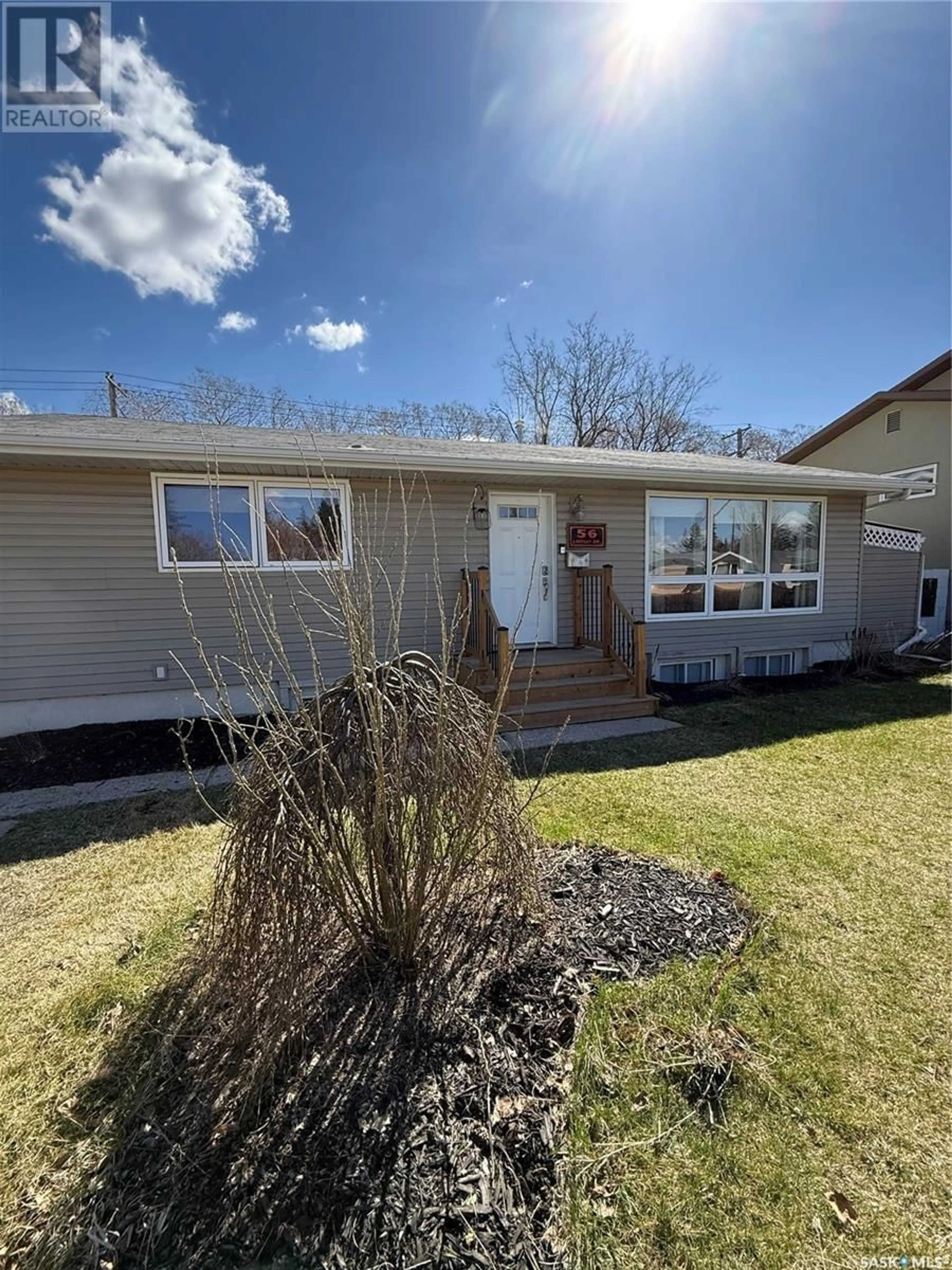 Home with vinyl exterior material, street for 56 LINDSAY DRIVE, Saskatoon Saskatchewan S7H3E1