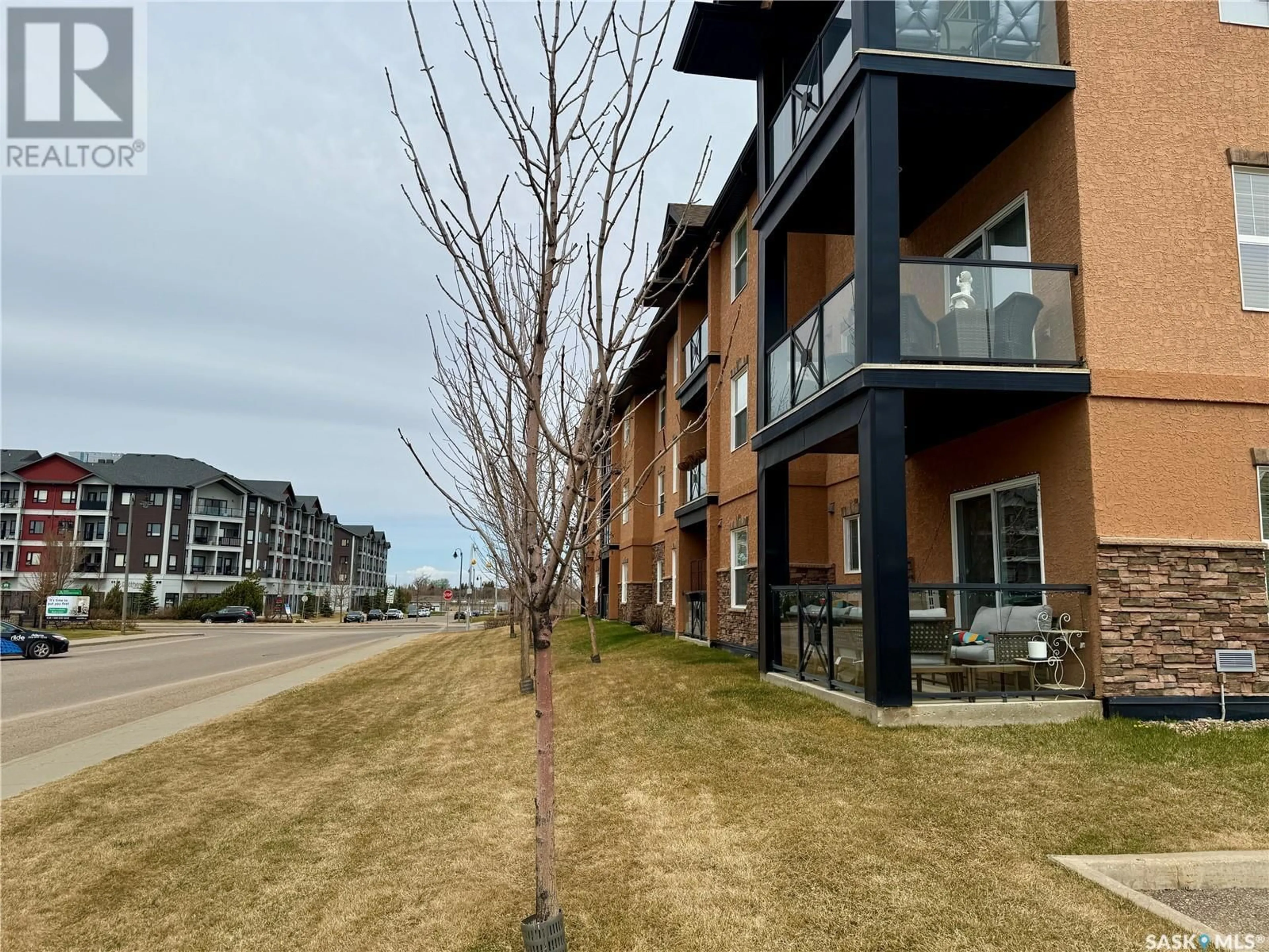 A pic from outside/outdoor area/front of a property/back of a property/a pic from drone, street for A106 - 103 WELLMAN CRESCENT, Saskatoon Saskatchewan S7T0C1