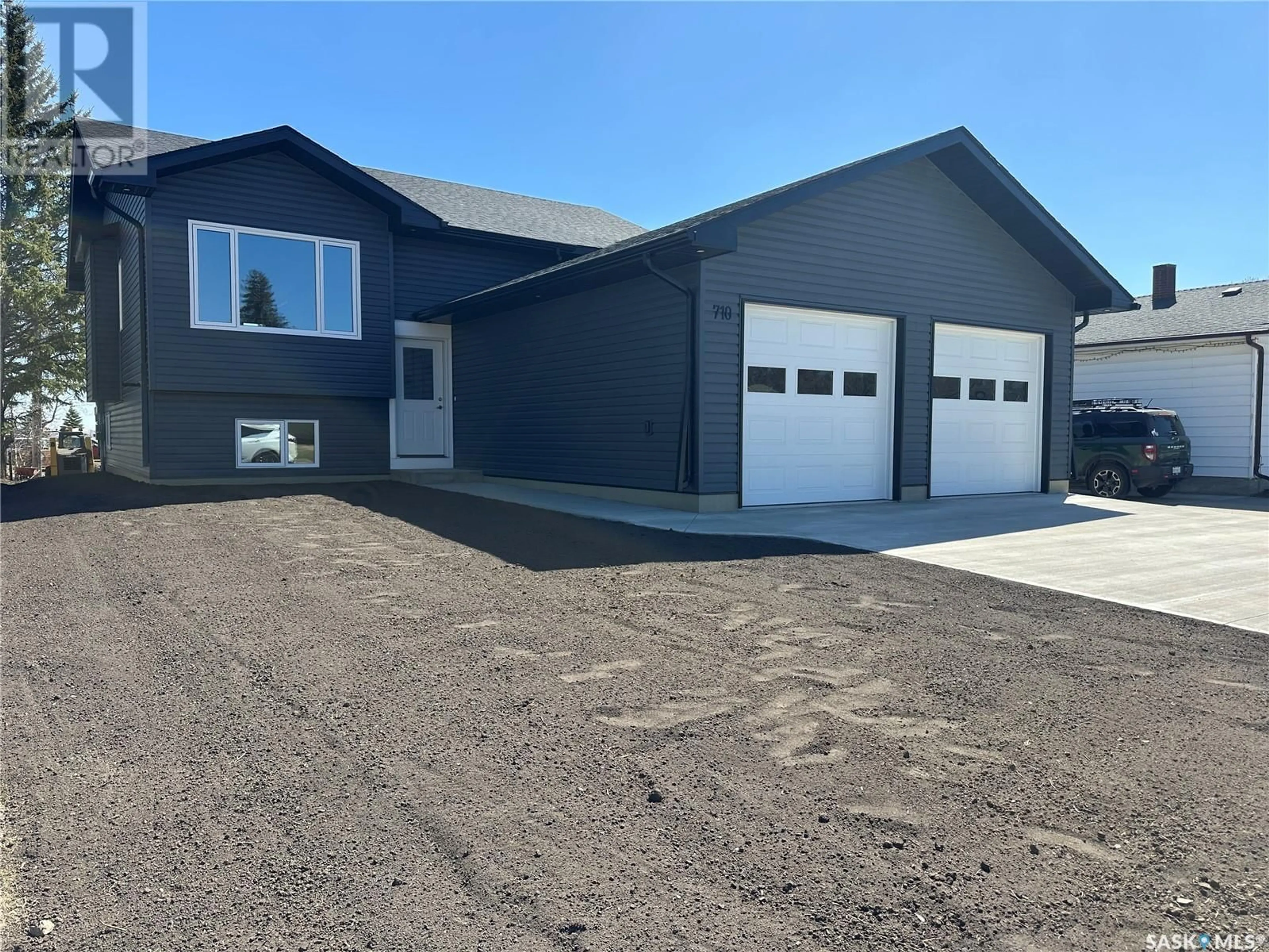 Home with vinyl exterior material, street for 710 3RD STREET, Humboldt Saskatchewan S0K2A0