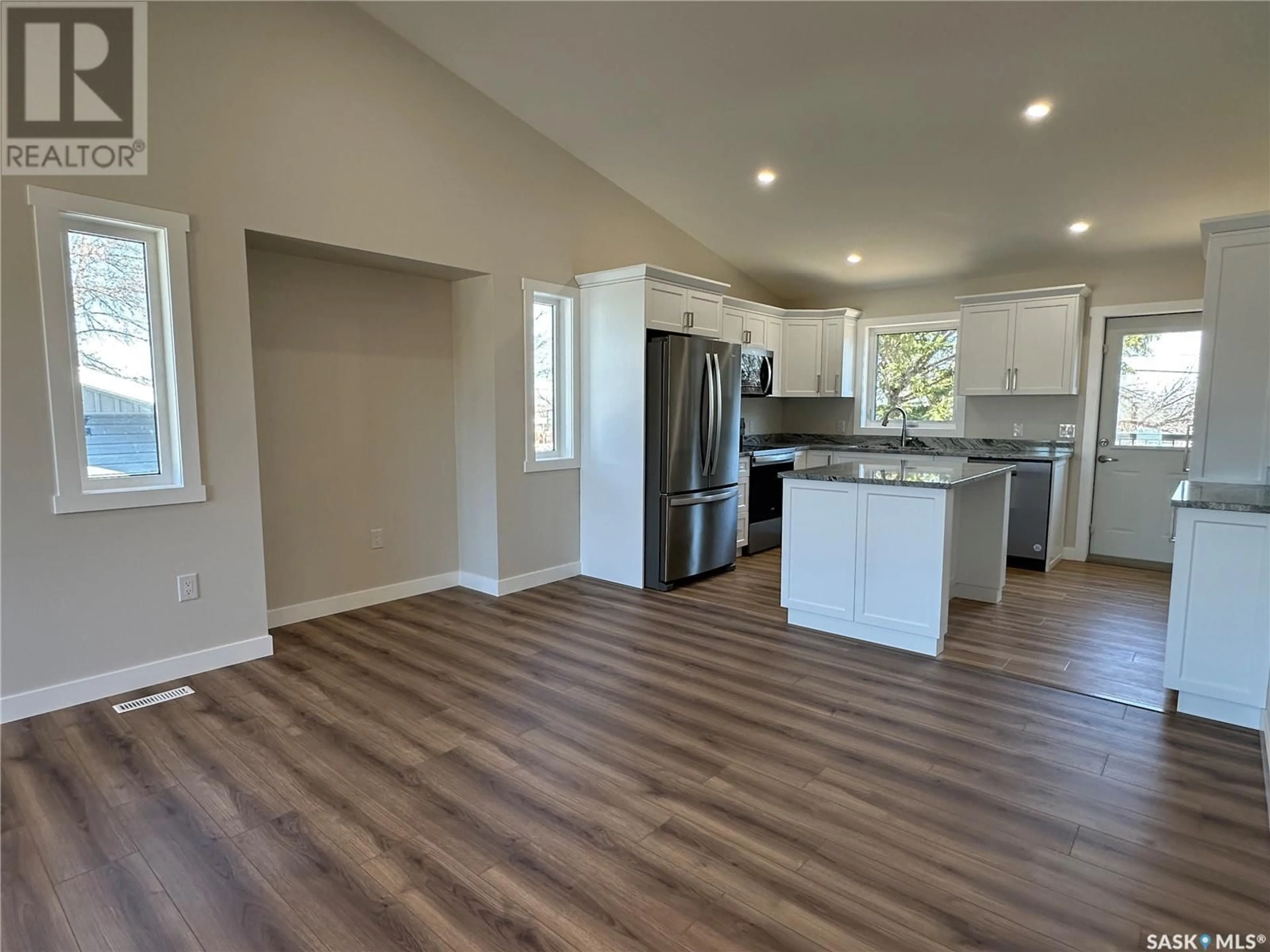 Open concept kitchen, wood/laminate floor for 710 3RD STREET, Humboldt Saskatchewan S0K2A0