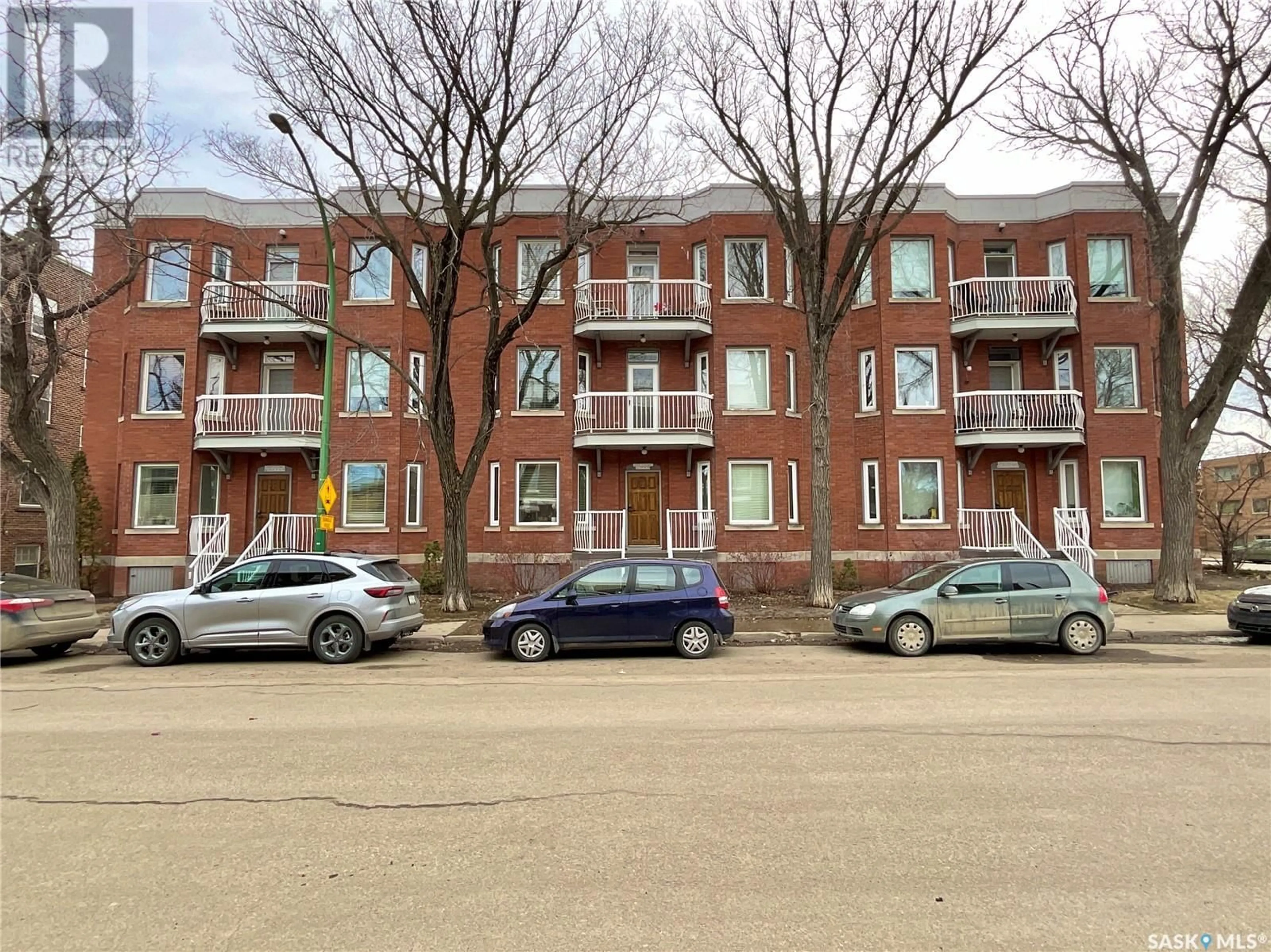 A pic from outside/outdoor area/front of a property/back of a property/a pic from drone, street for 304 - 2925 14TH AVENUE, Regina Saskatchewan S4T1R6