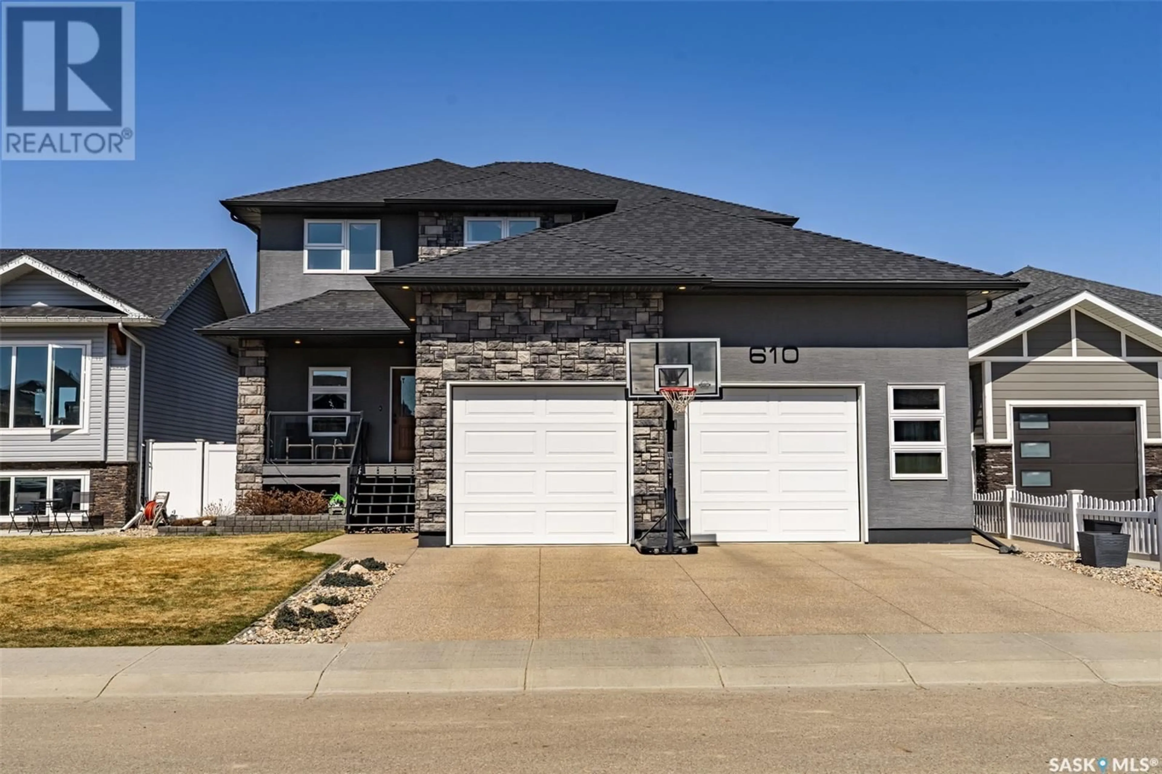 Home with brick exterior material, street for 610 CASPER COVE, Warman Saskatchewan S0K4S4