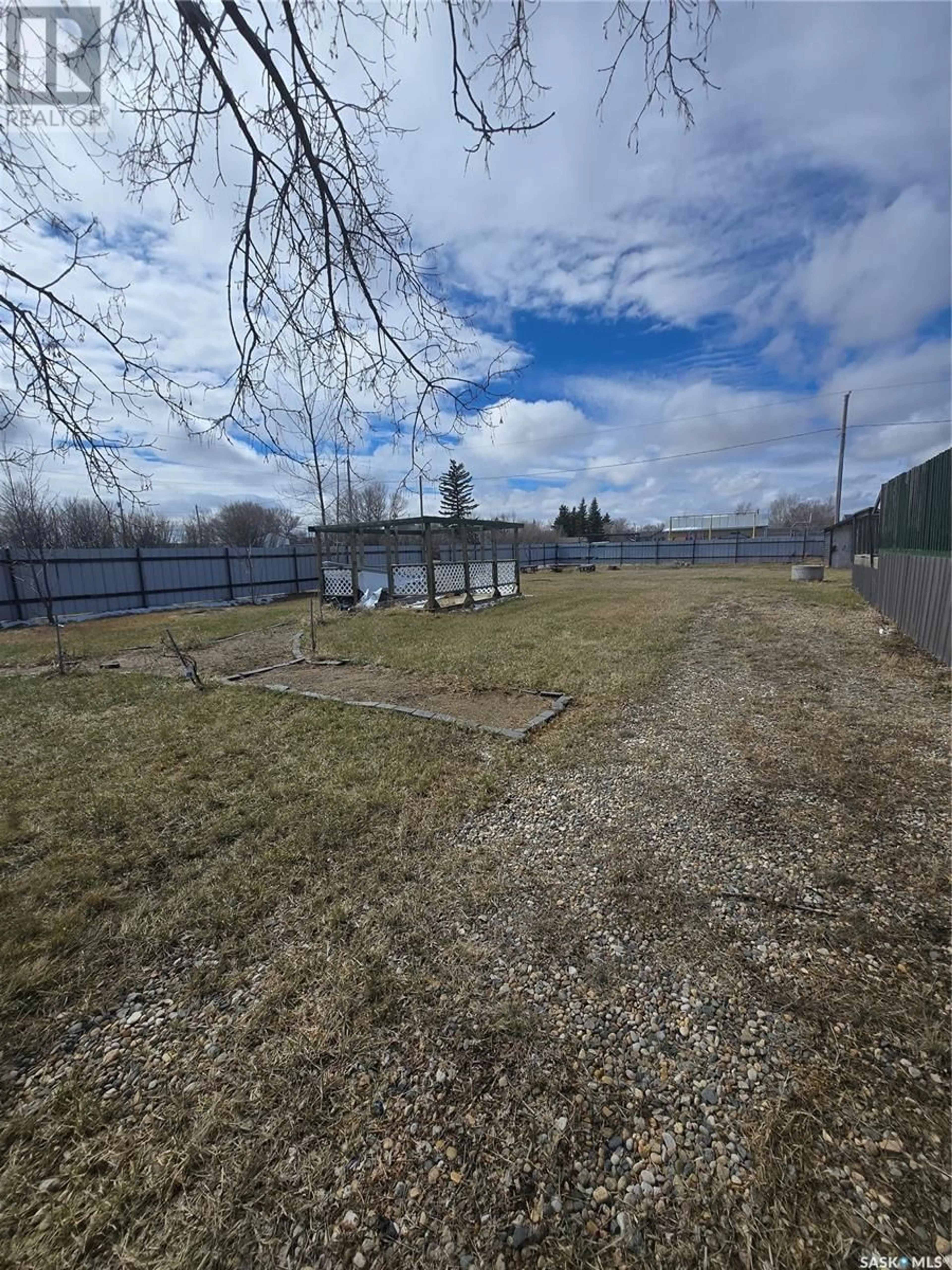 A pic from outside/outdoor area/front of a property/back of a property/a pic from drone, water/lake/river/ocean view for 220 MAIN STREET, Benson Saskatchewan S0C0L0