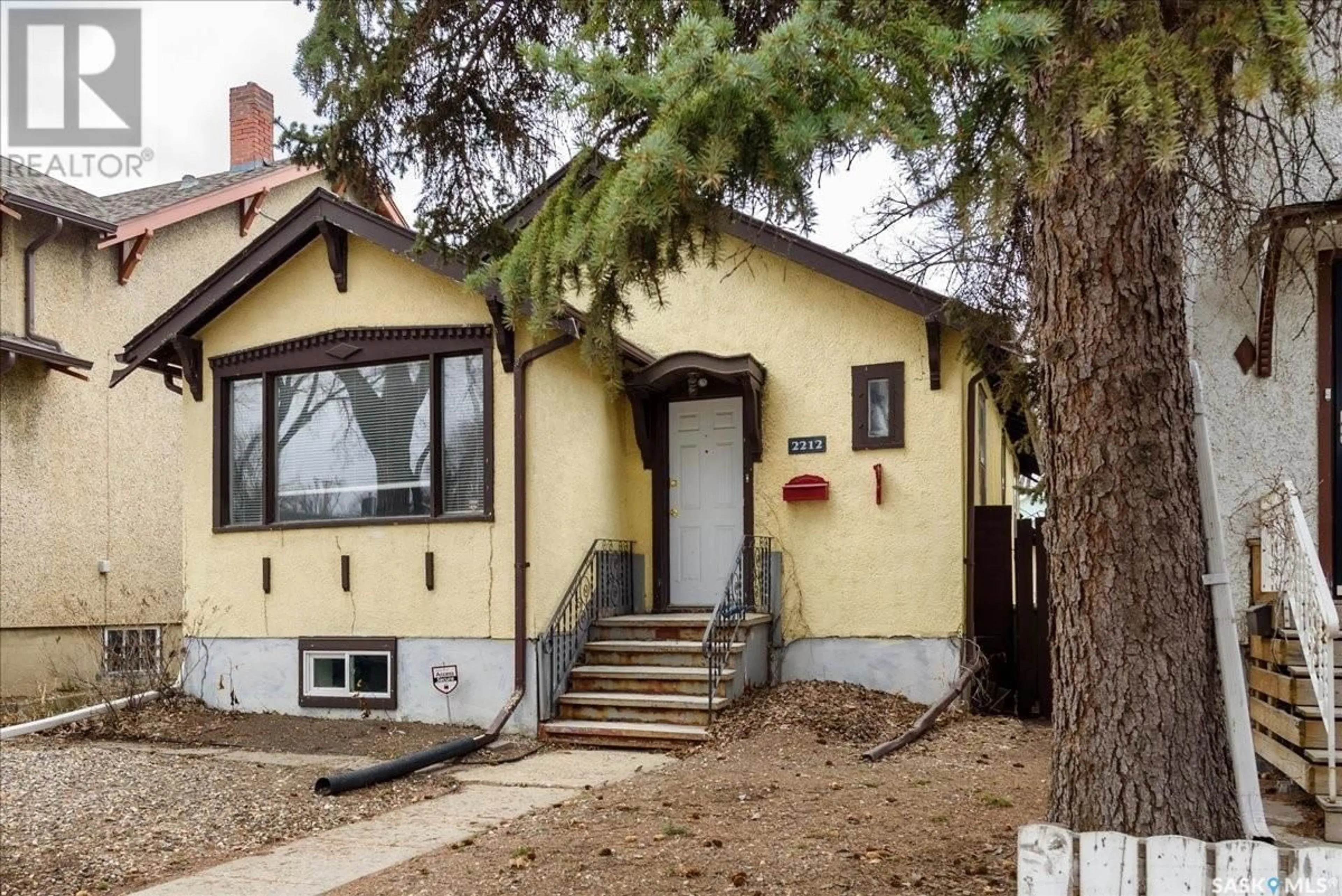Home with vinyl exterior material, street for 2212 WINNIPEG STREET, Regina Saskatchewan S4P1H1