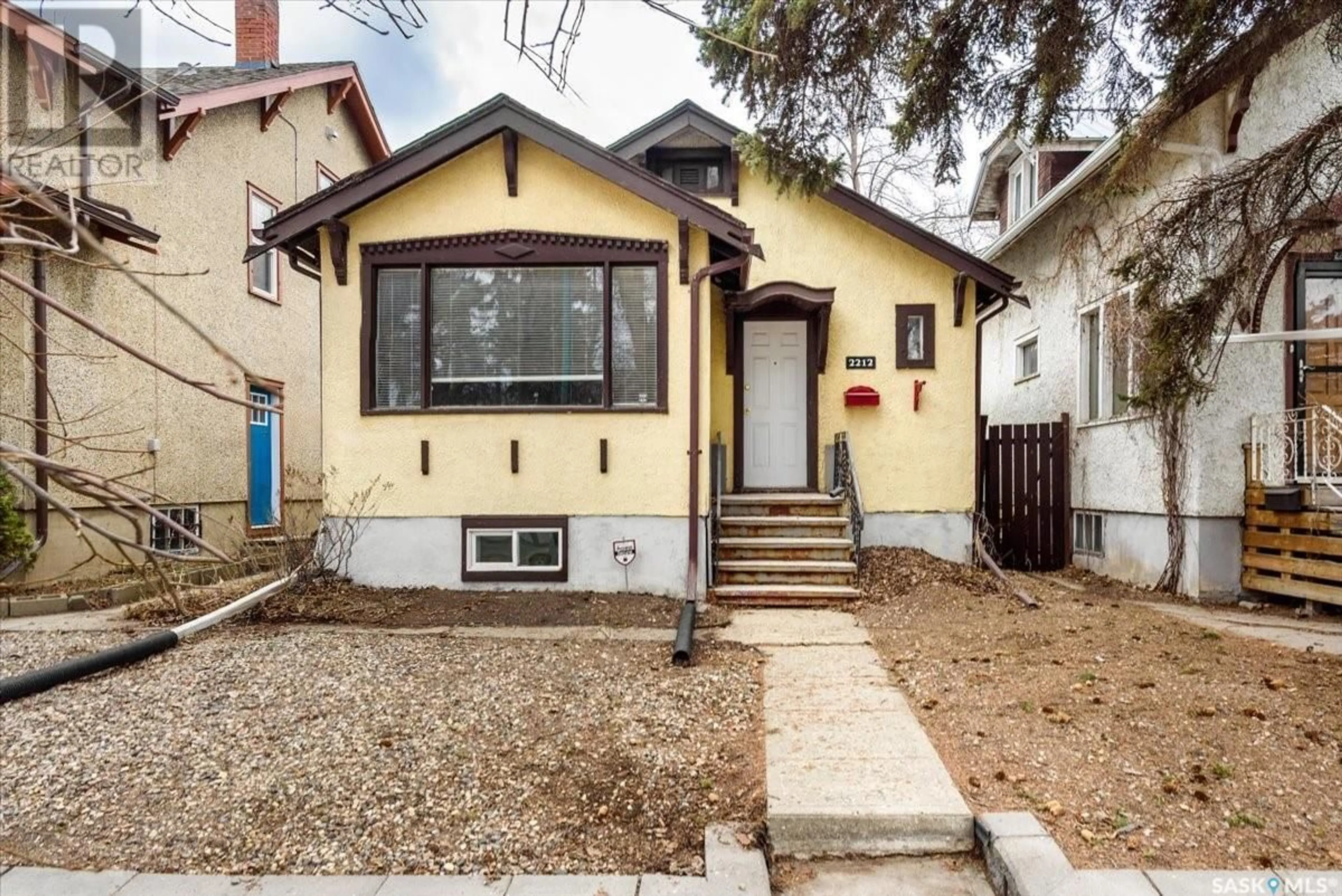 Home with vinyl exterior material, street for 2212 WINNIPEG STREET, Regina Saskatchewan S4P1H1