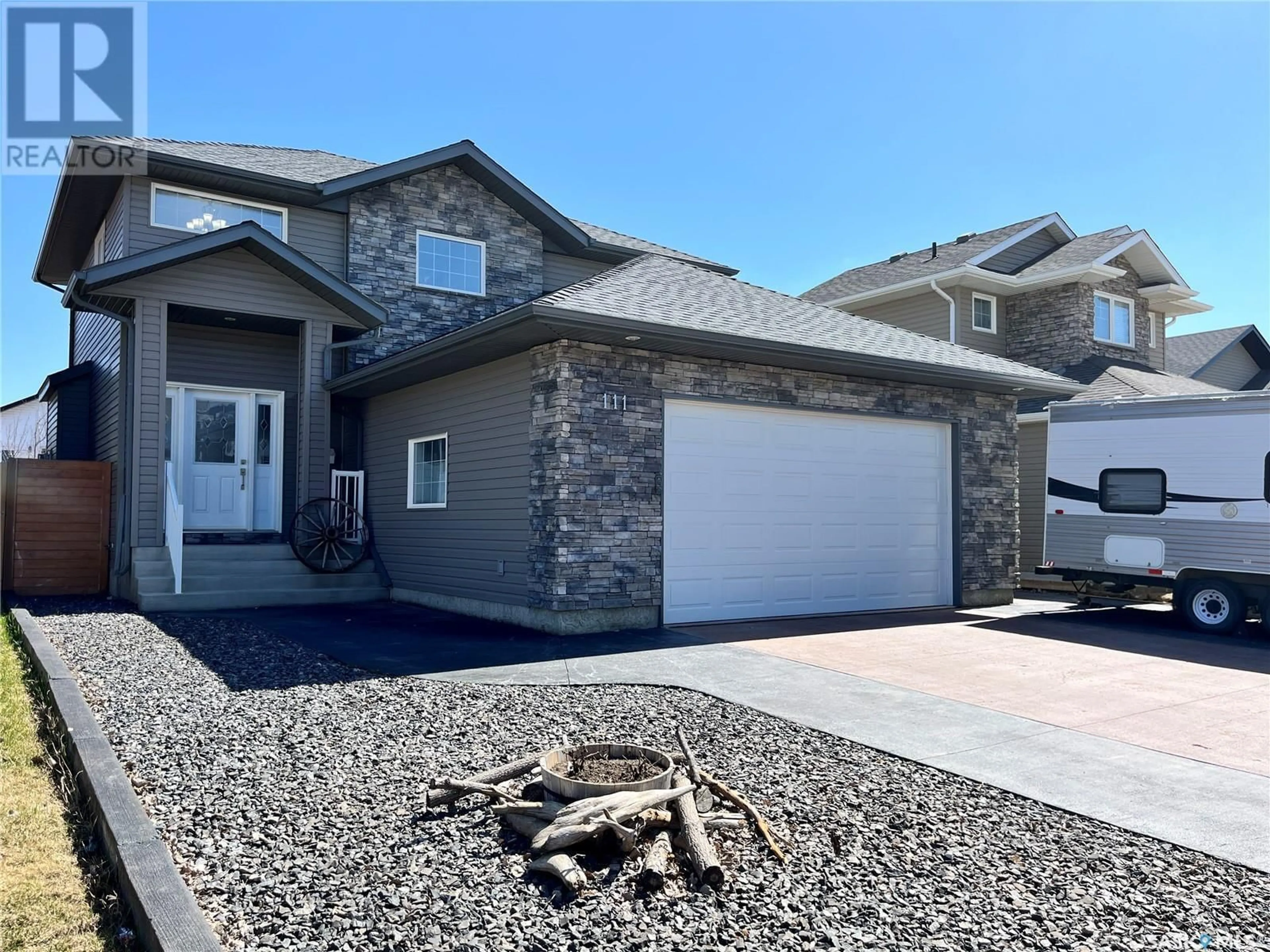 Home with vinyl exterior material, street for 111 ATTON CRESCENT, Saskatoon Saskatchewan S7W0K8
