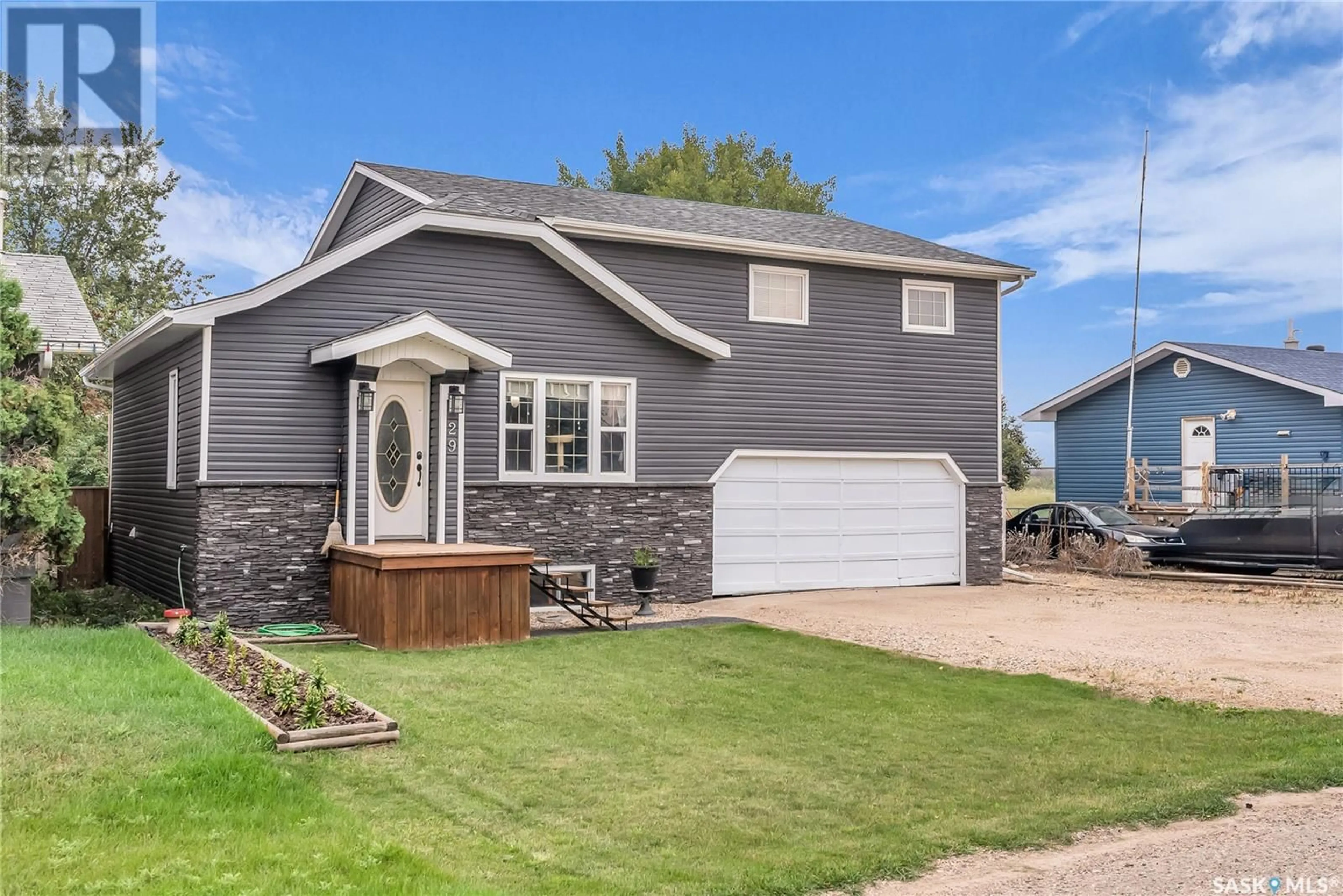 Home with vinyl exterior material, street for 29 MAIN STREET, Clavet Saskatchewan S0K0Y0