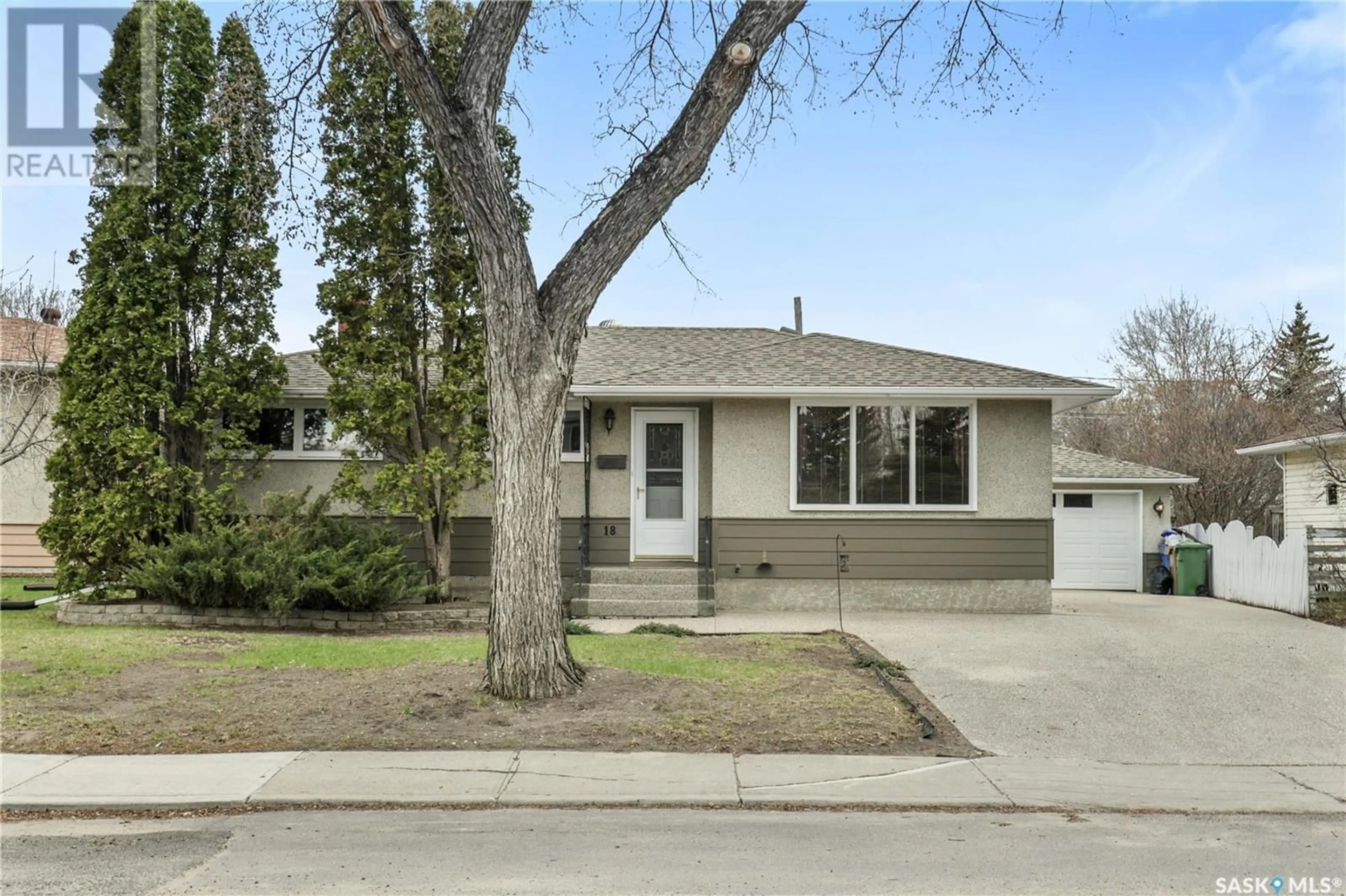 Home with vinyl exterior material, street for 18 HALLERAN CRESCENT, Regina Saskatchewan S4R3Z4