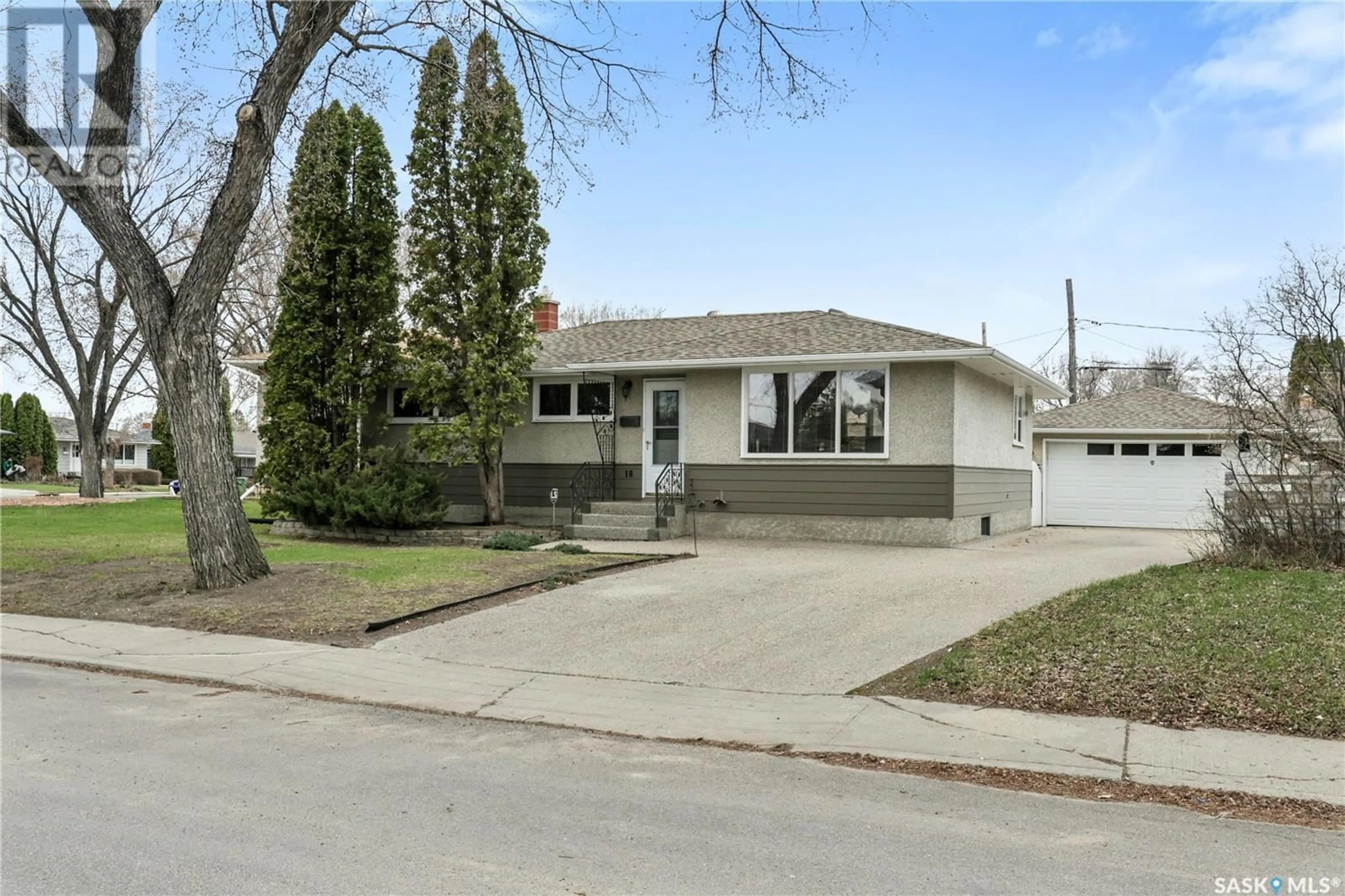 Home with vinyl exterior material, street for 18 HALLERAN CRESCENT, Regina Saskatchewan S4R3Z4