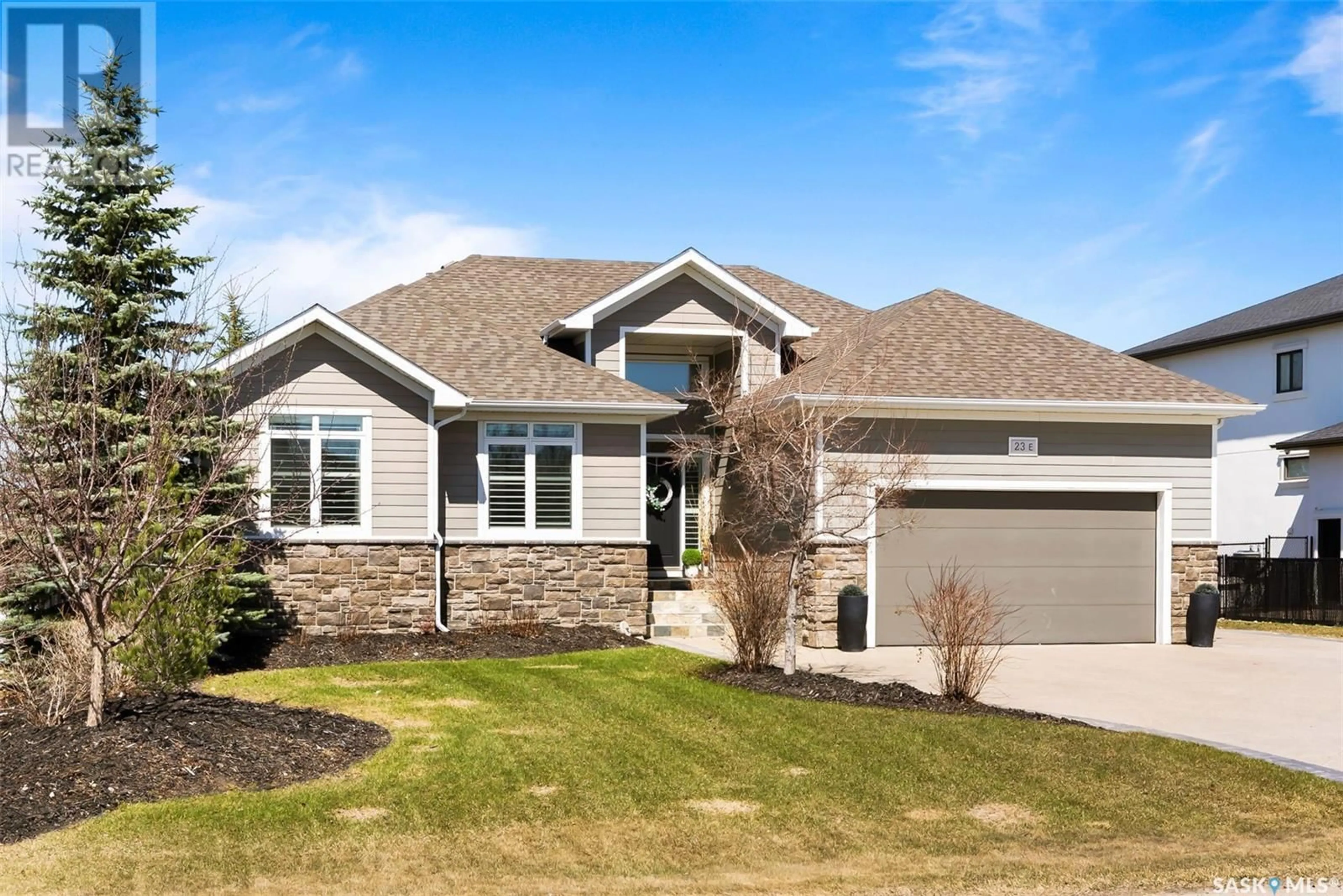 Home with vinyl exterior material, street for 23 LOTT ROAD, White City Saskatchewan S4L0B7