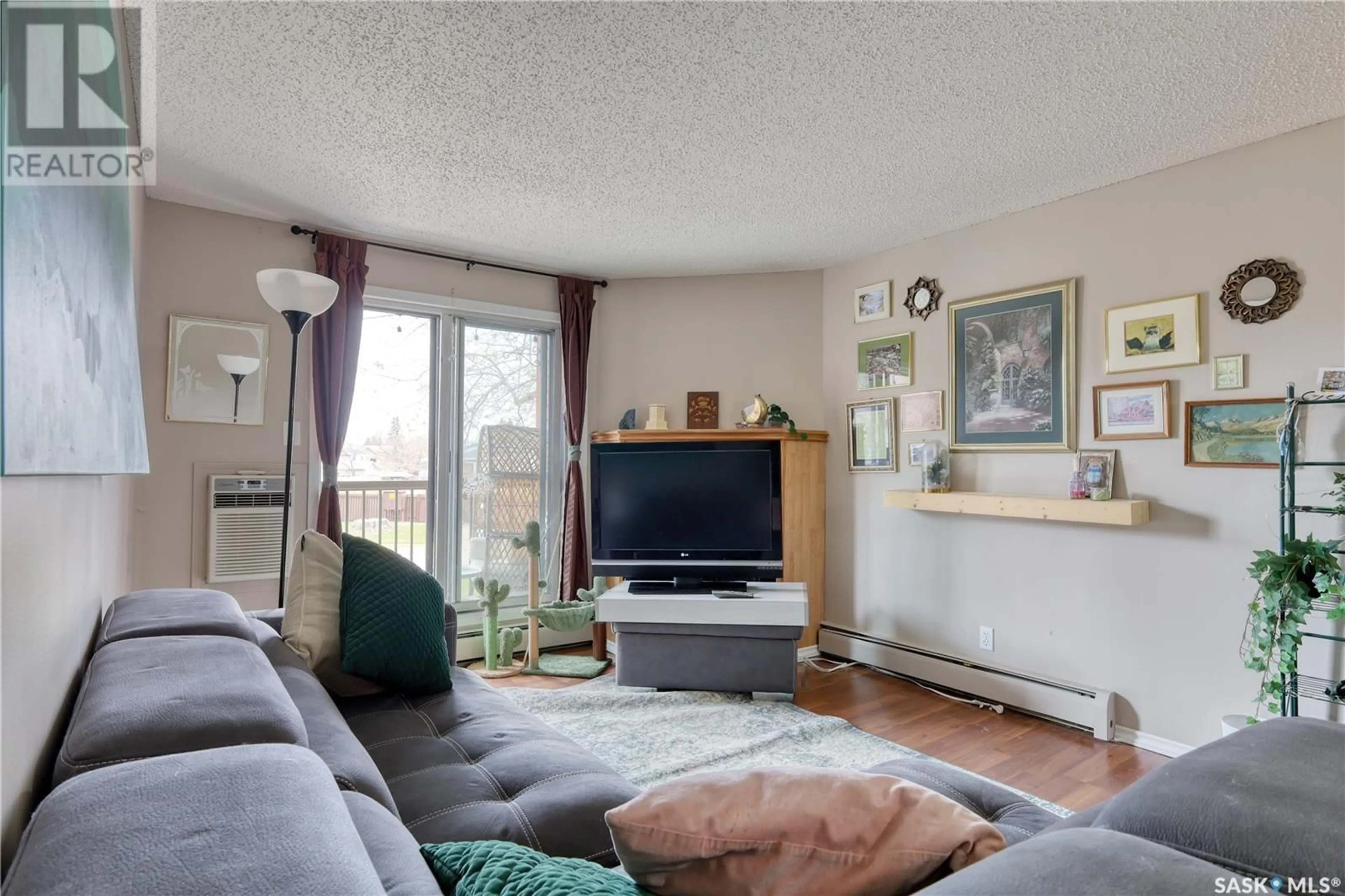 Living room with furniture, unknown for 204 - 3308 33RD STREET, Saskatoon Saskatchewan S7L6X6