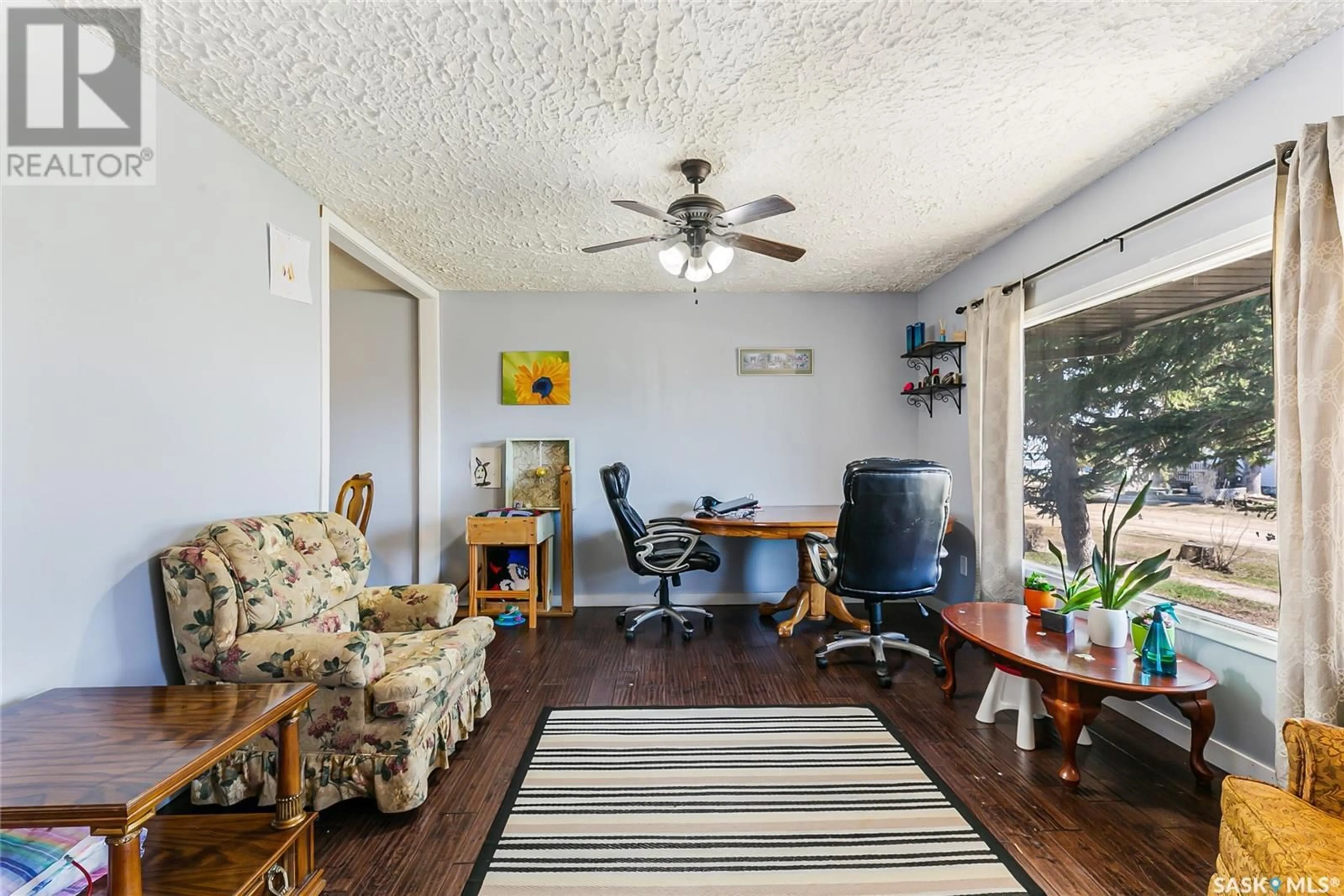 Living room with furniture, wood/laminate floor for 1551 FROHLICK STREET, Holdfast Saskatchewan S0G2H0