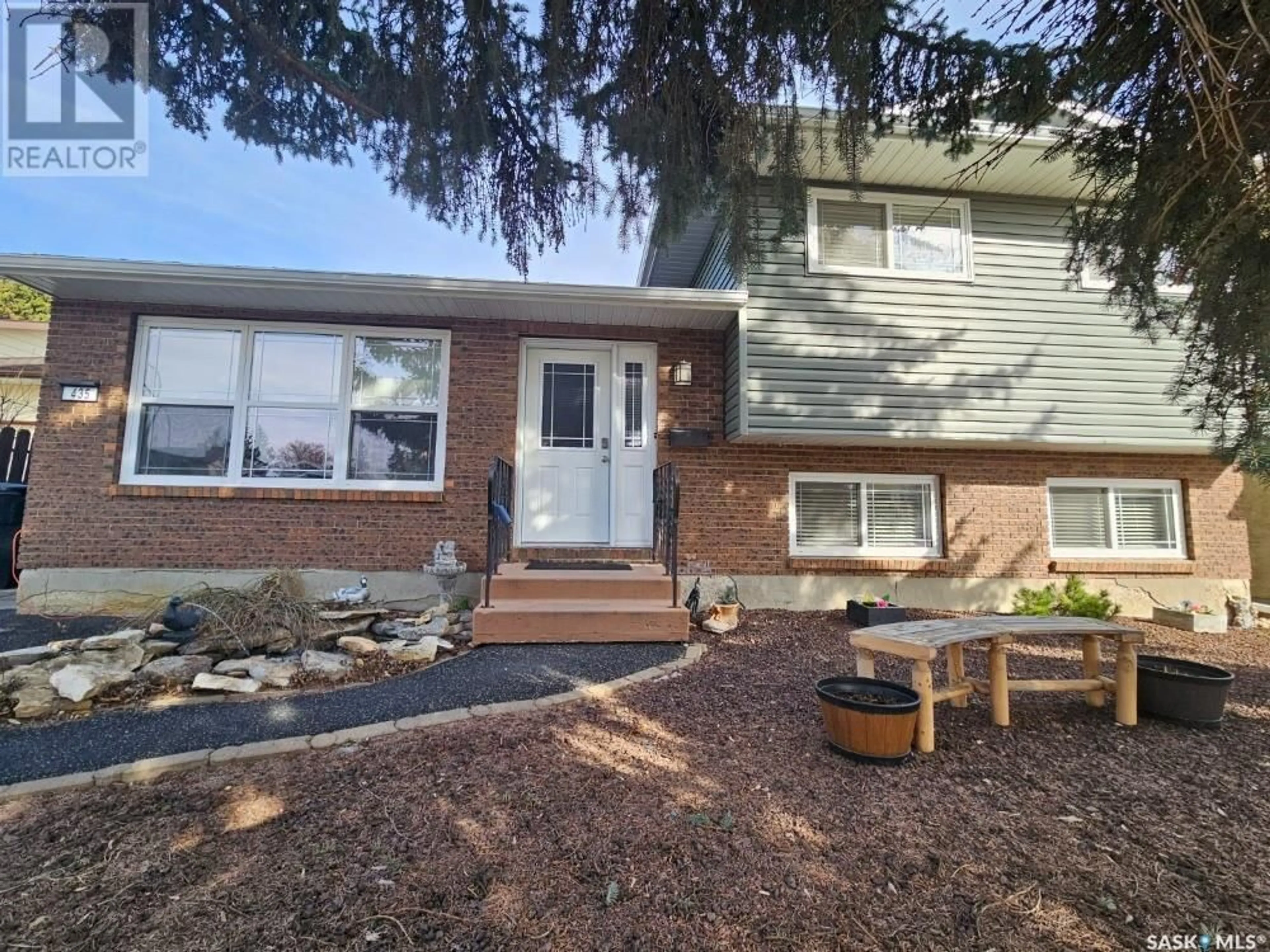 Home with vinyl exterior material, street for 435 CHARLEBOIS WAY, Saskatoon Saskatchewan S7K5J8